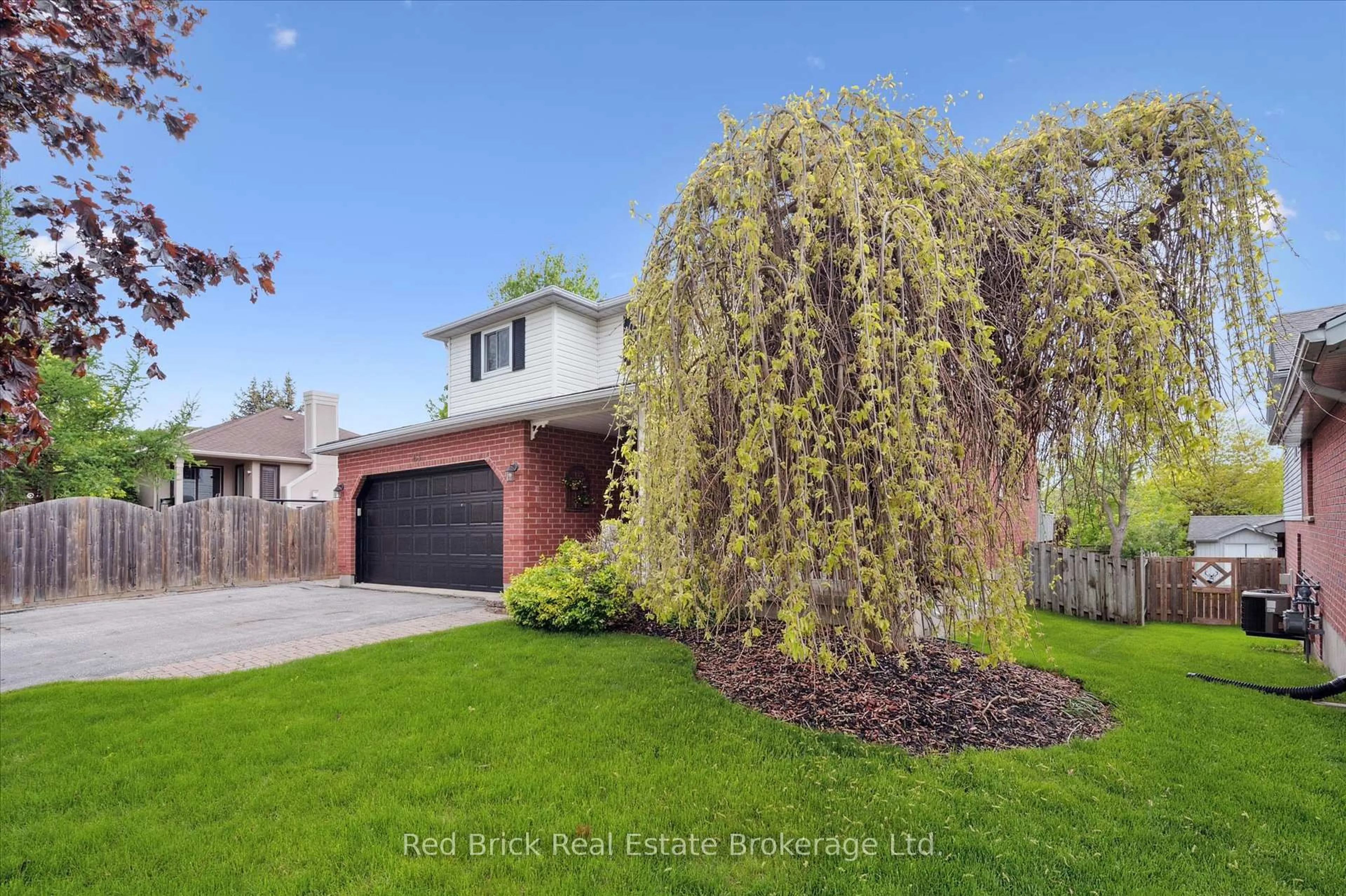 Home with brick exterior material, street for 63 Flaherty Dr, Guelph Ontario N1H 8K6