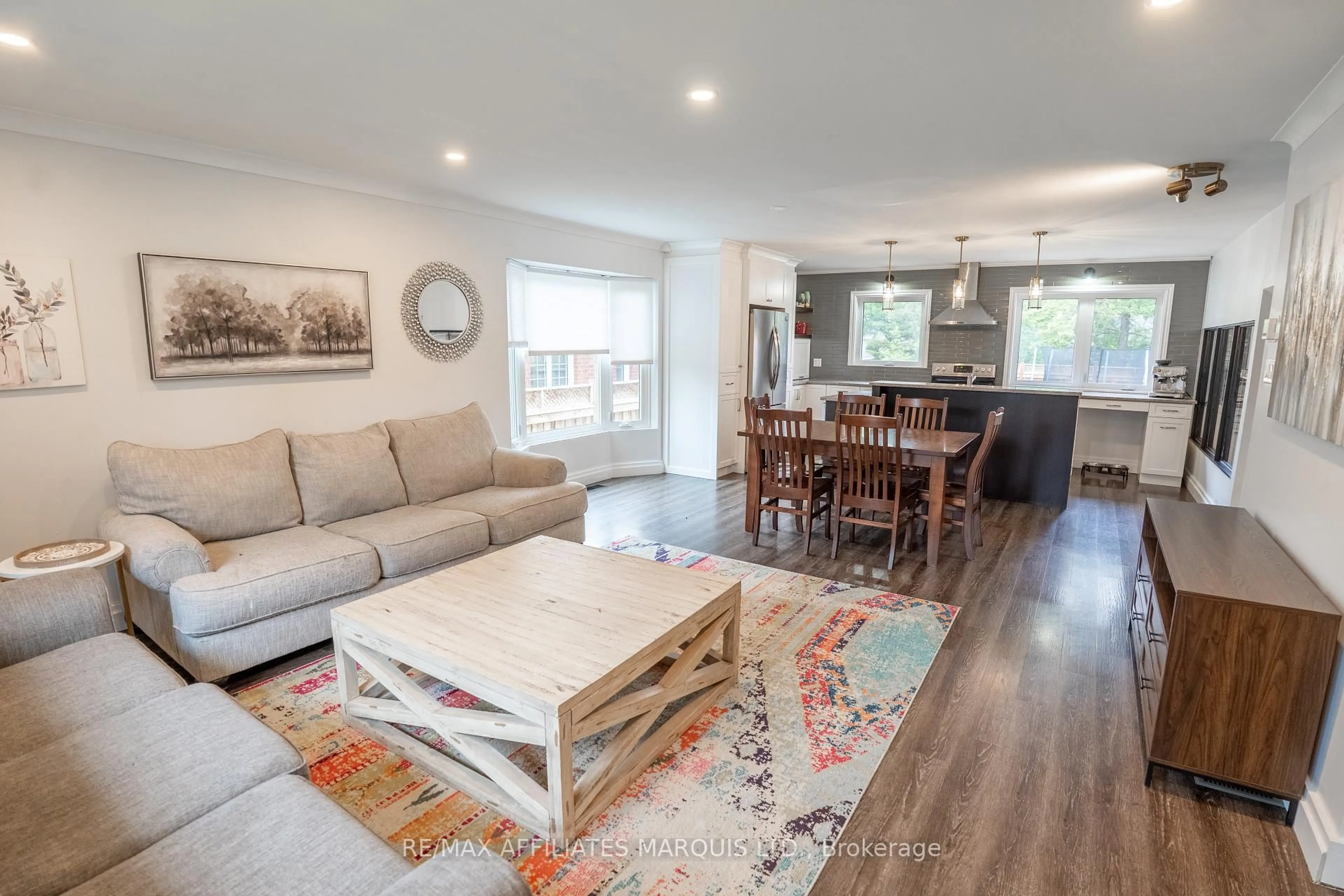 Living room with furniture, wood/laminate floor for 1143 Stokes Dr, Cornwall Ontario K6J 5J6