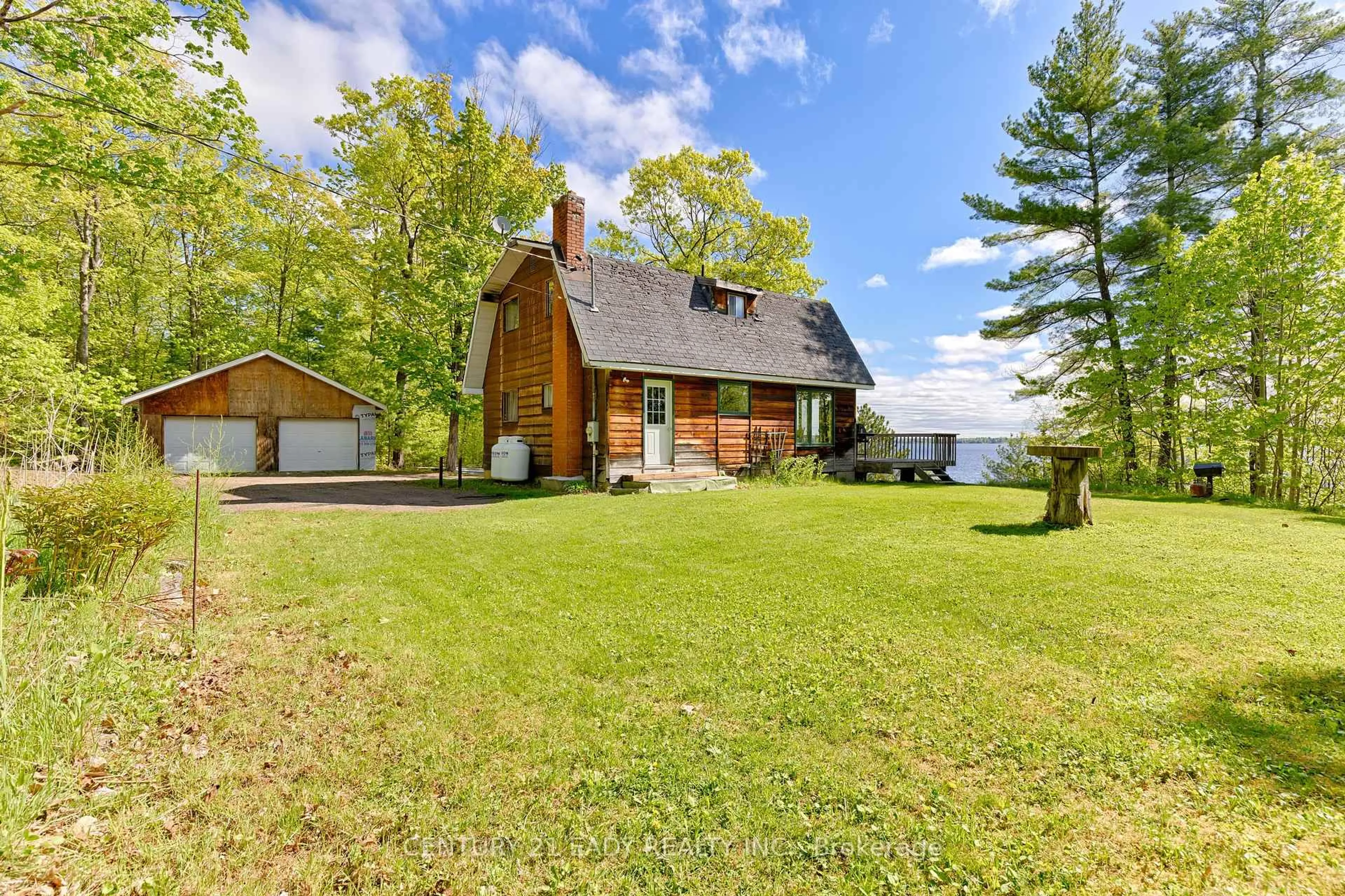 A pic from outside/outdoor area/front of a property/back of a property/a pic from drone, water/lake/river/ocean view for 1044 Beachs Lane, Calabogie Ontario K0J 1H0