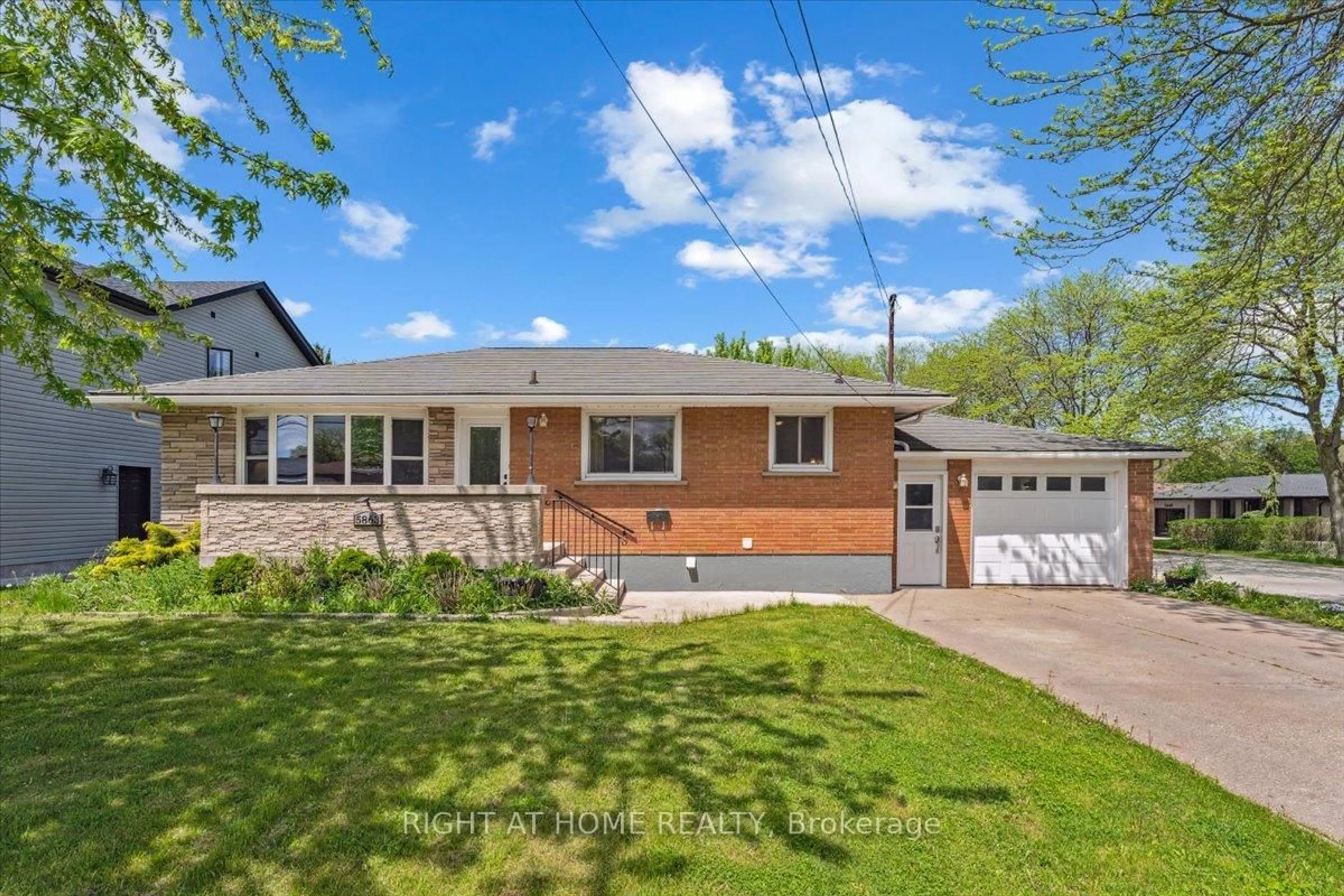 Home with brick exterior material, street for 5863 CHURCH'S Lane, Niagara Falls Ontario L2J 1Y9