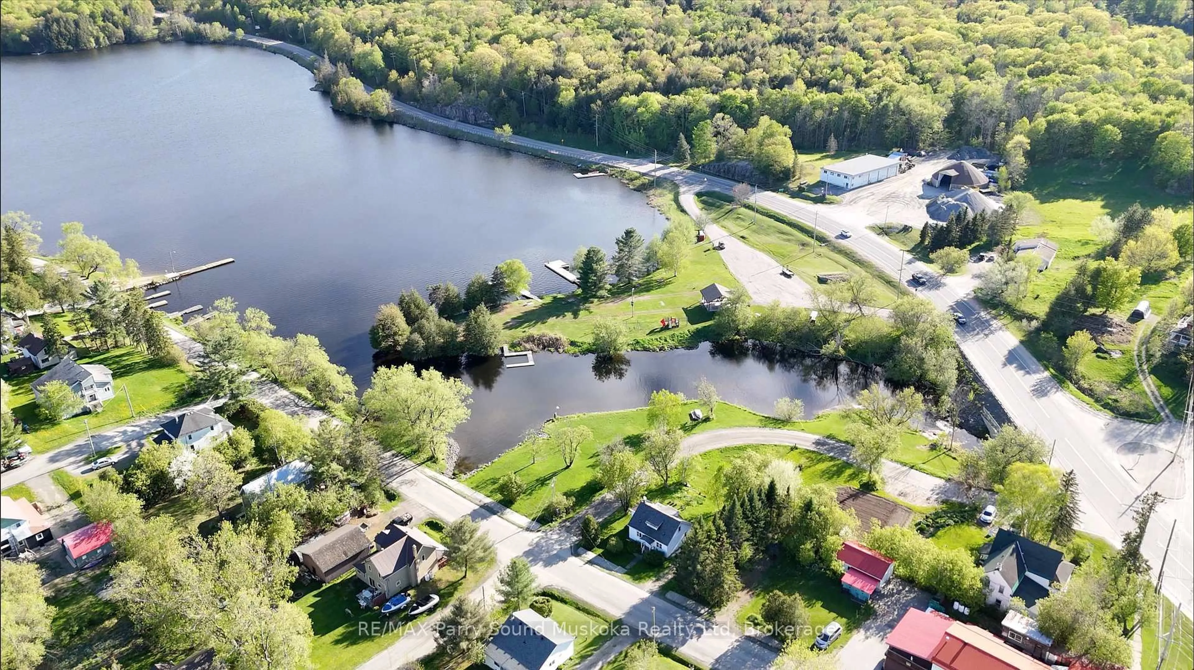 A pic from outside/outdoor area/front of a property/back of a property/a pic from drone, water/lake/river/ocean view for 17 Harriet St, McKellar Ontario P0G 1C0