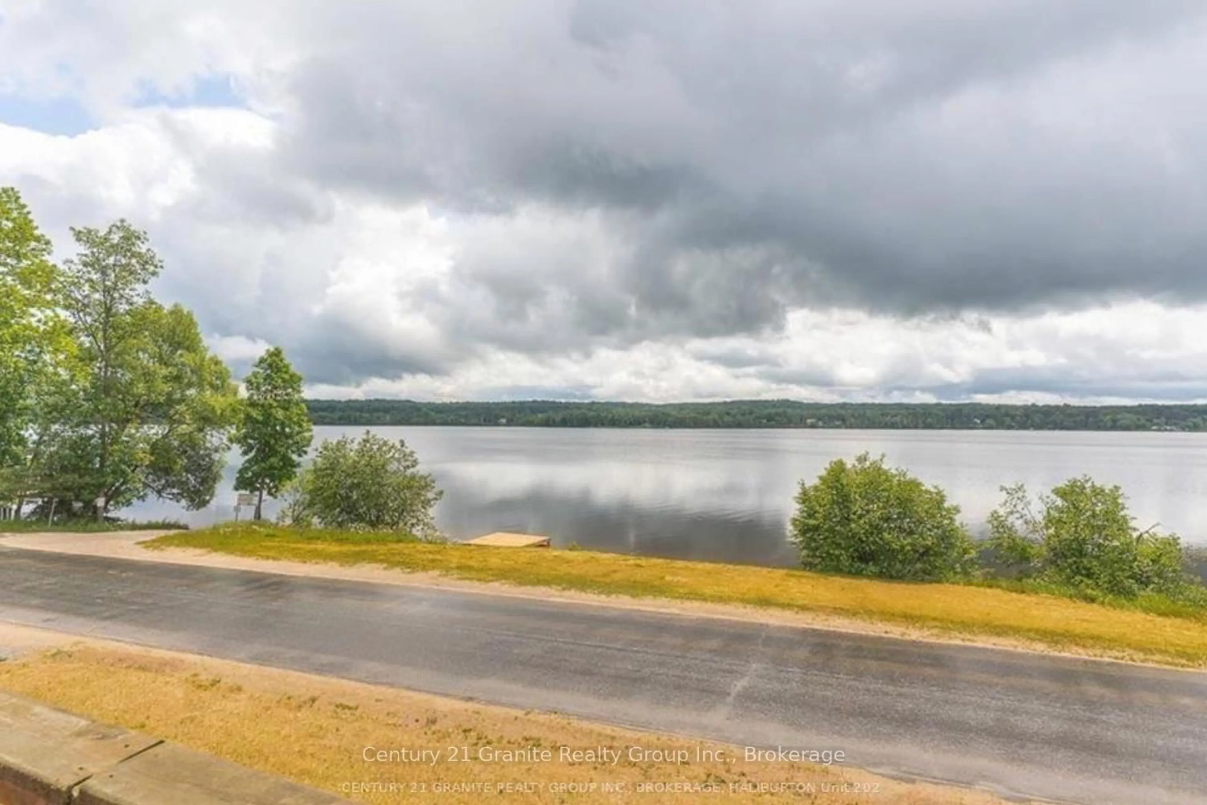 A pic from outside/outdoor area/front of a property/back of a property/a pic from drone, water/lake/river/ocean view for 1359 Green Lake Rd, Dysart et al Ontario K0M 1S0
