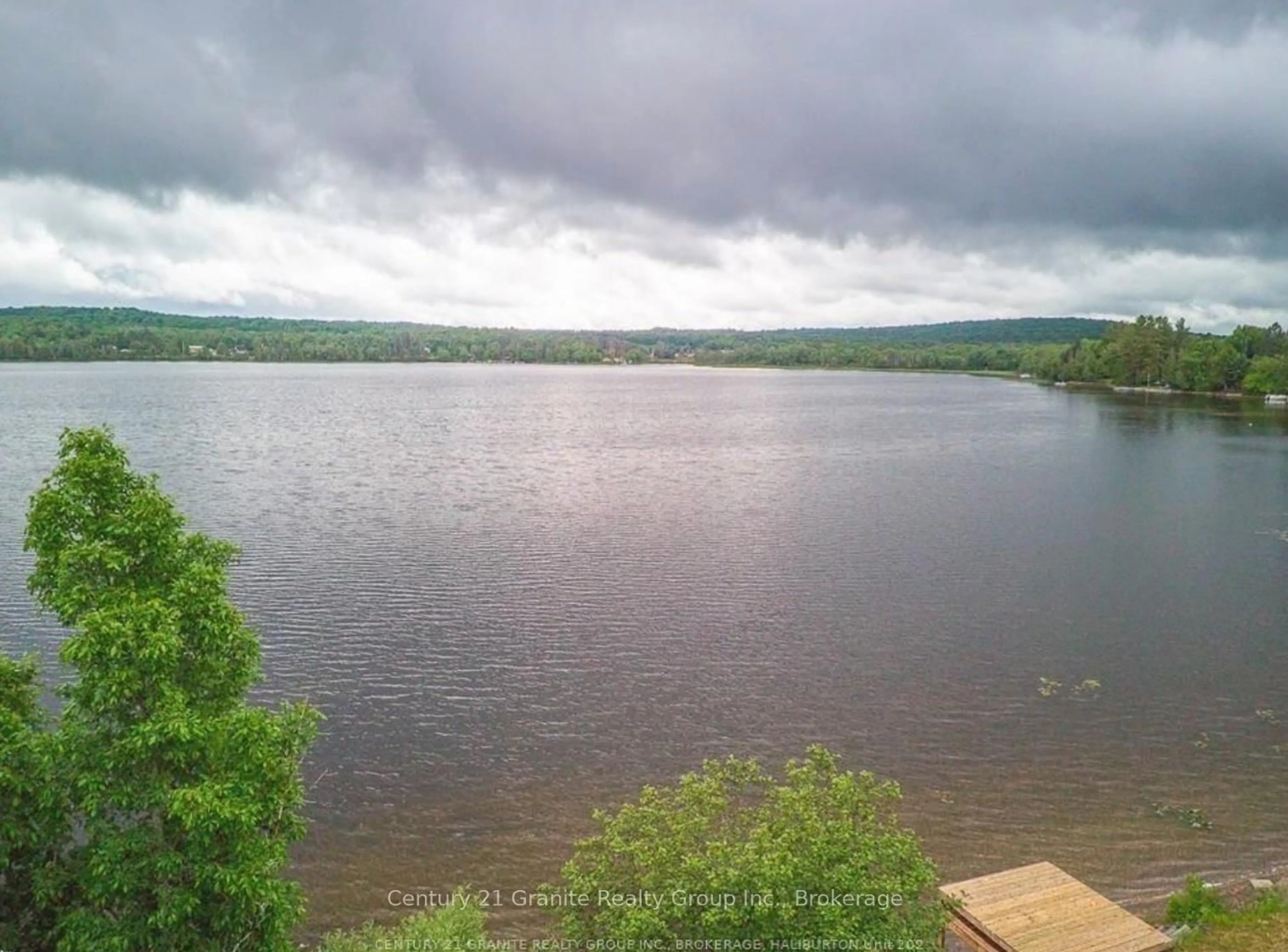 A pic from outside/outdoor area/front of a property/back of a property/a pic from drone, water/lake/river/ocean view for 1359 Green Lake Rd, Dysart et al Ontario K0M 1S0