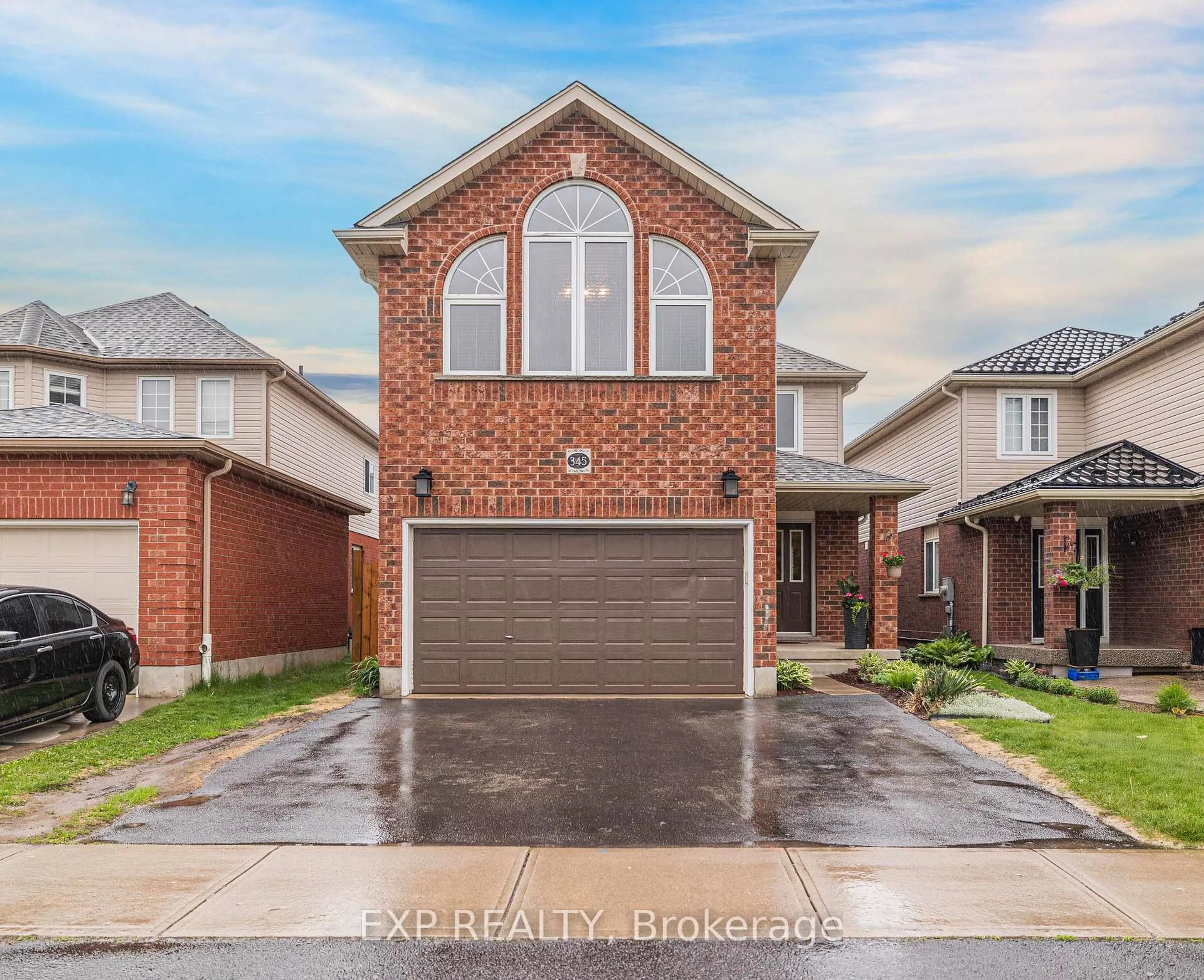 Home with brick exterior material, street for 345 Thomas Slee Dr, Kitchener Ontario N2P 2X5