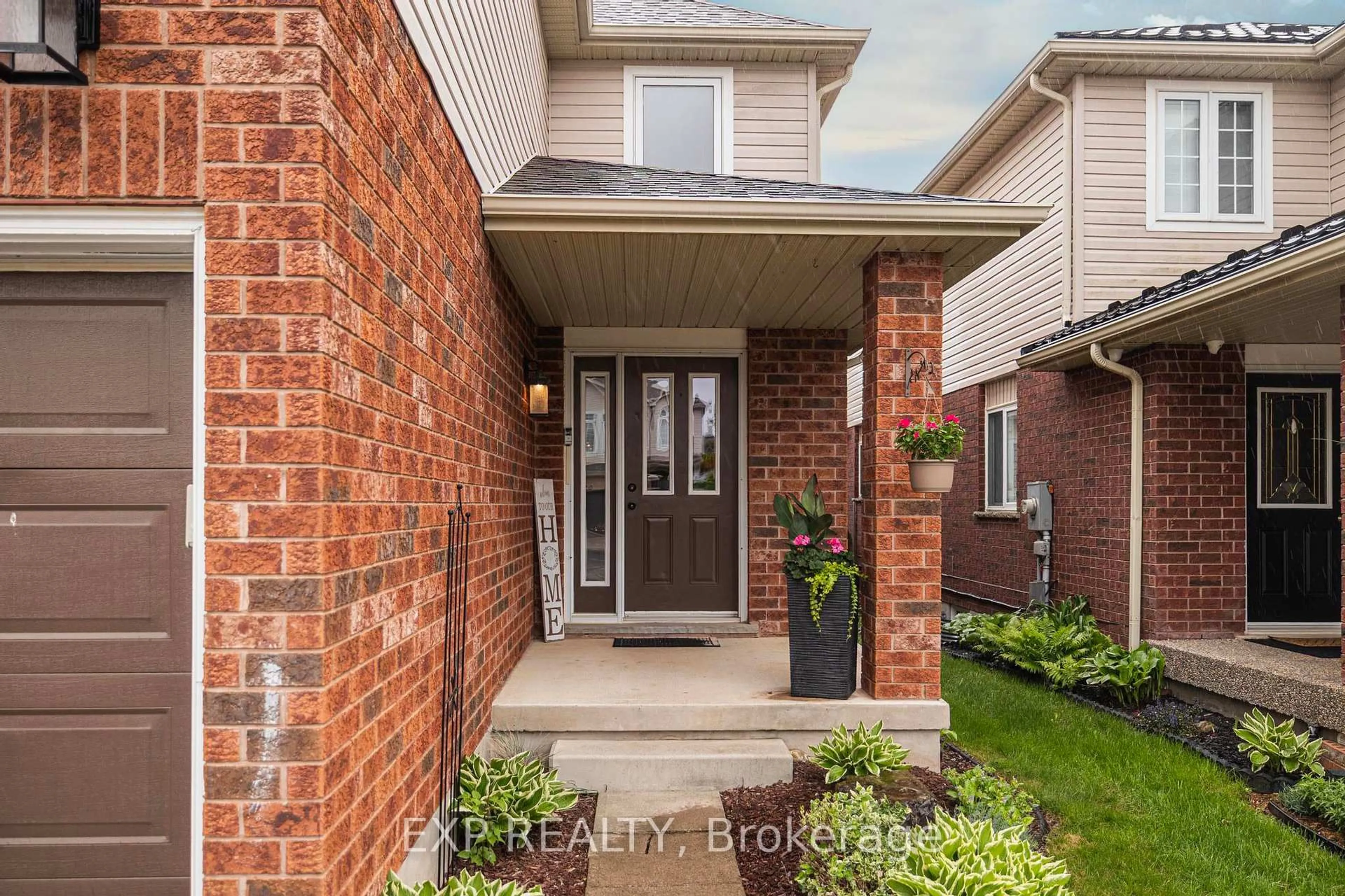 Home with brick exterior material, street for 345 Thomas Slee Dr, Kitchener Ontario N2P 2X5