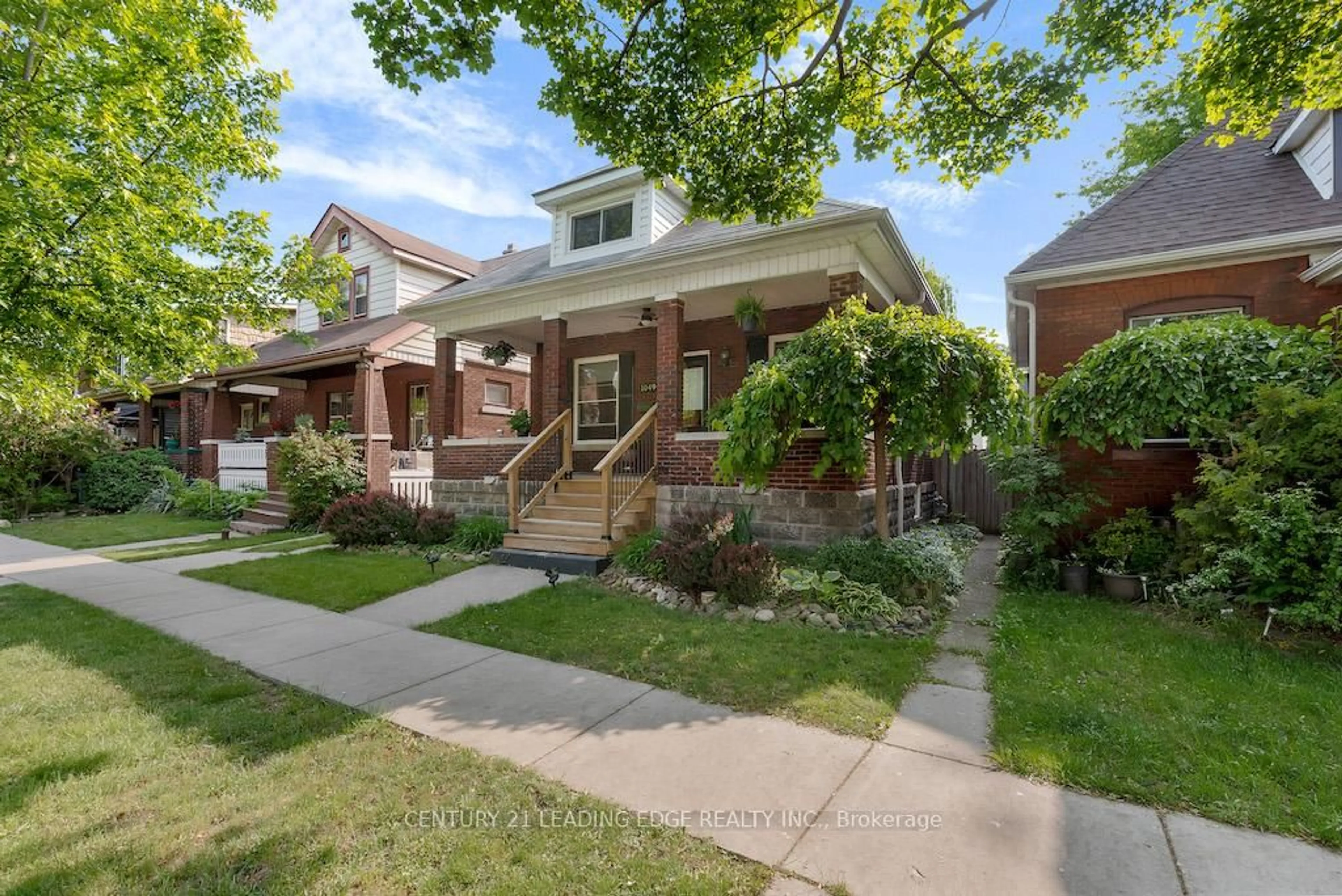 Home with brick exterior material, street for 1049 Windermere Rd, Windsor Ontario N8Y 3E5