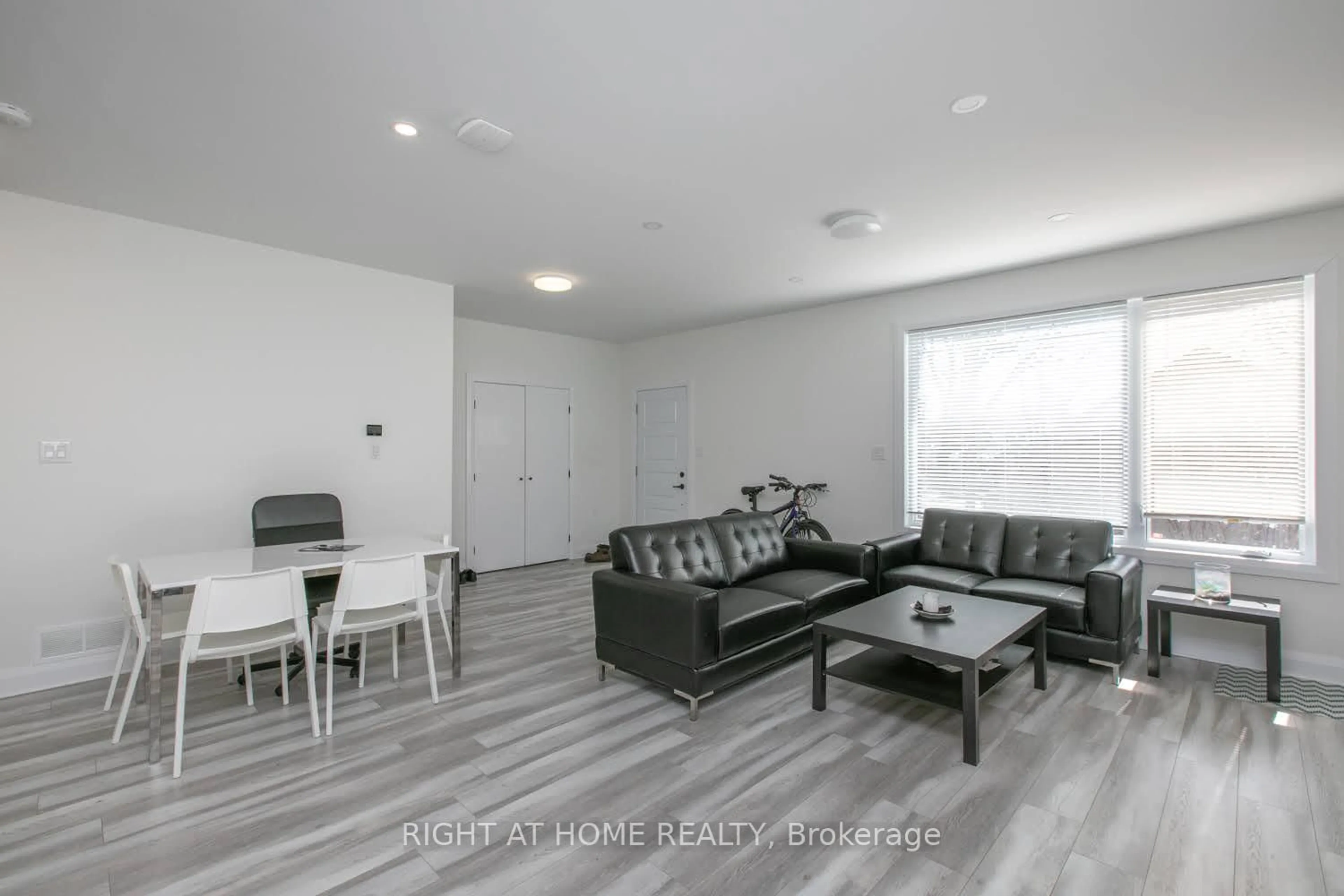 Living room with furniture, unknown for 1558-62 Baseline Rd, Ottawa Ontario K2C 0B3