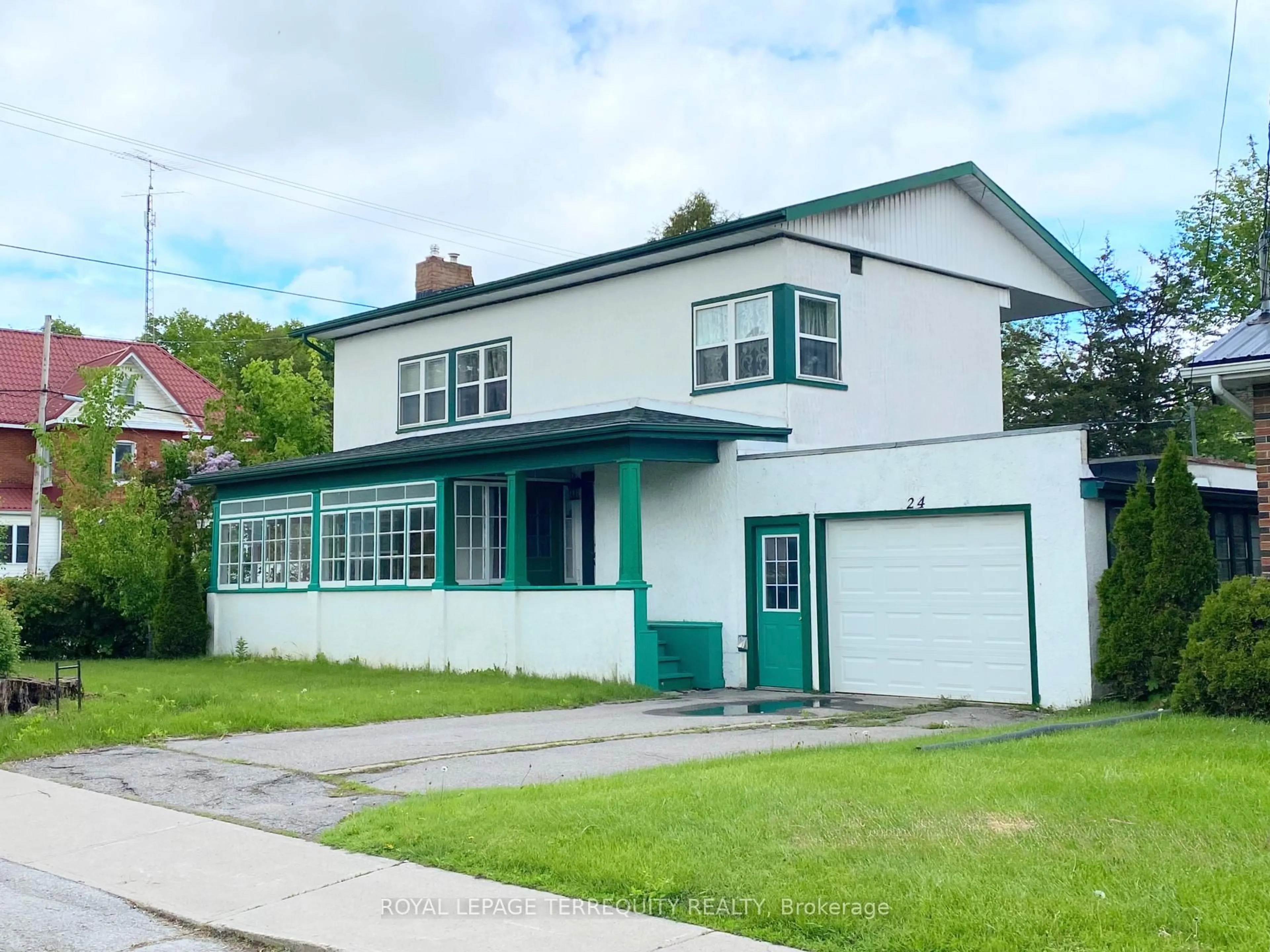 Home with vinyl exterior material, street for 24 Bridge St, Tweed Ontario K0K 3J0