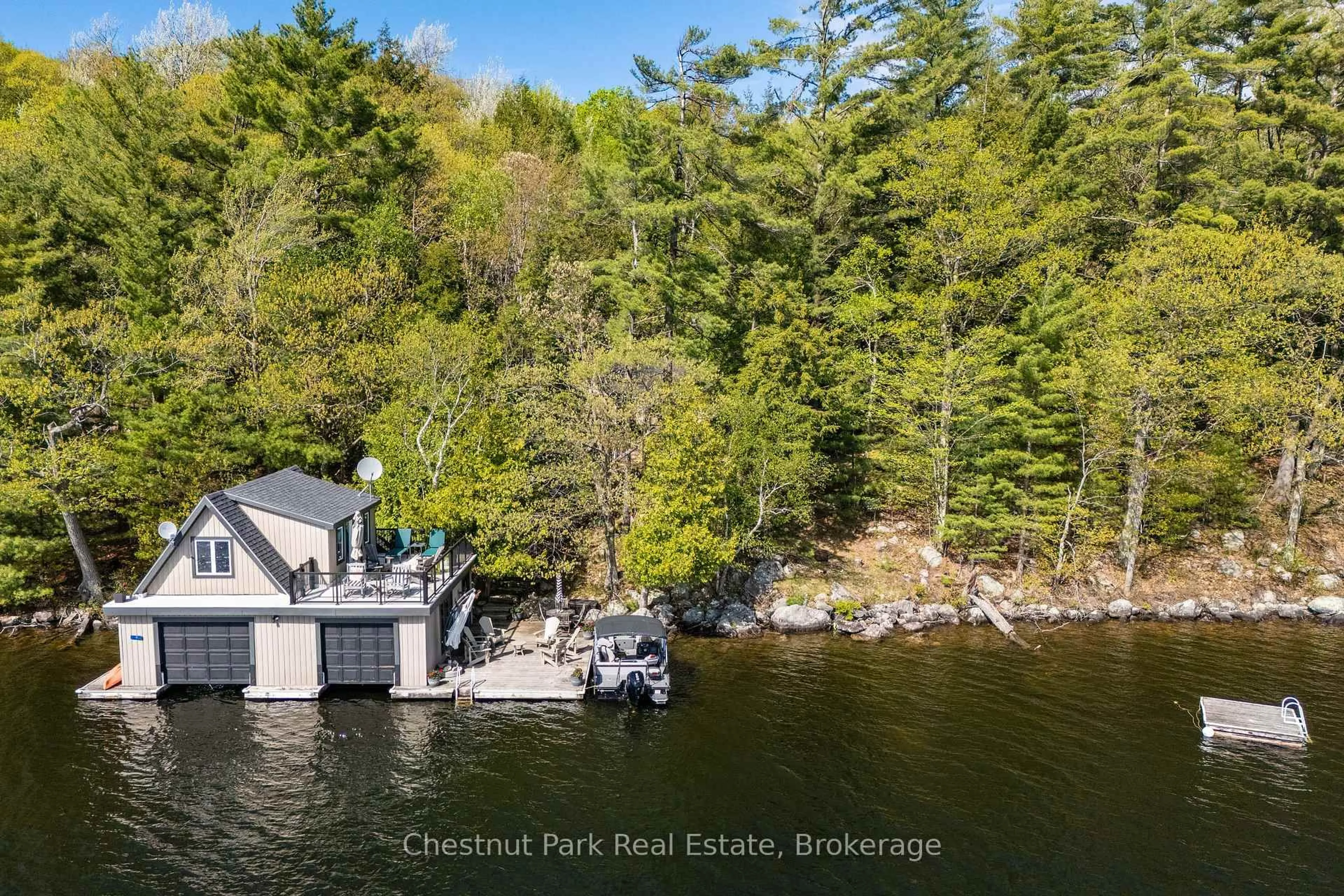 A pic from outside/outdoor area/front of a property/back of a property/a pic from drone, water/lake/river/ocean view for 57 Mazengah R52, Minett N/A, Muskoka Lakes Ontario P0B 1J0