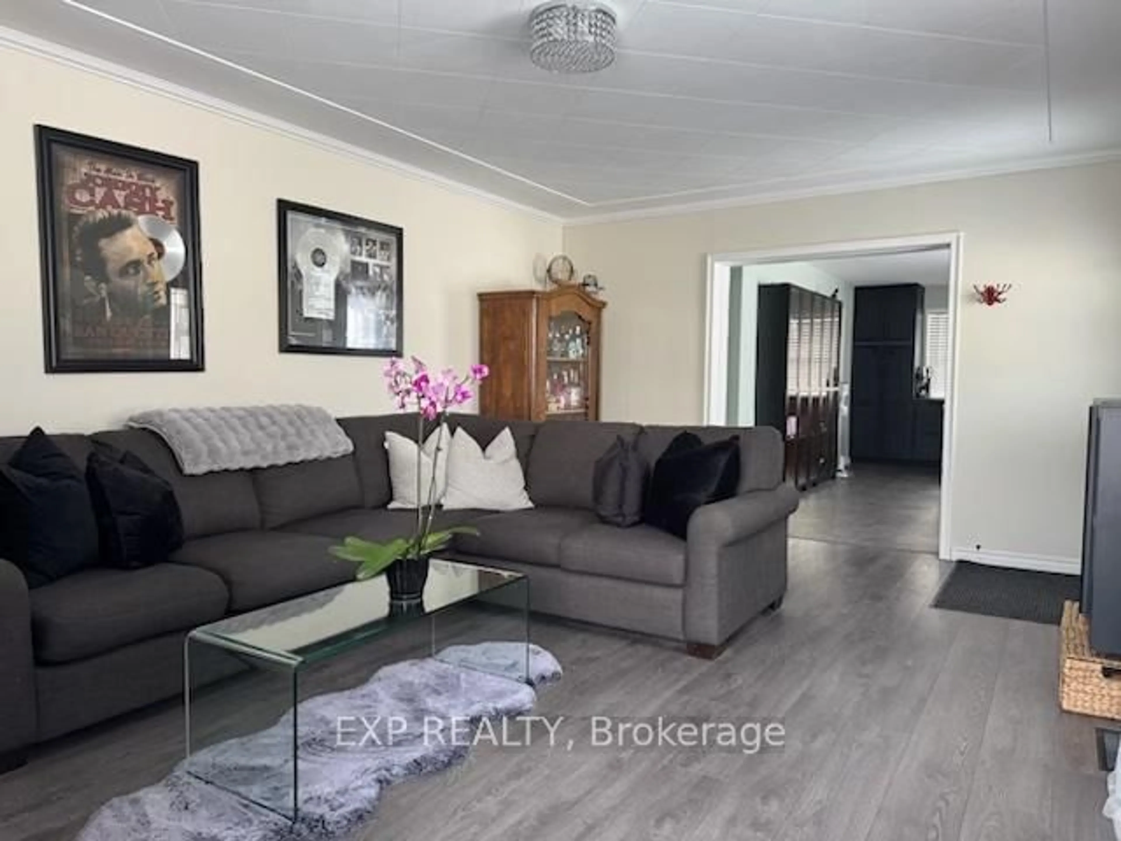Living room with furniture, wood/laminate floor for 20 Dubeau St, West Nipissing Ontario P0H 2M0