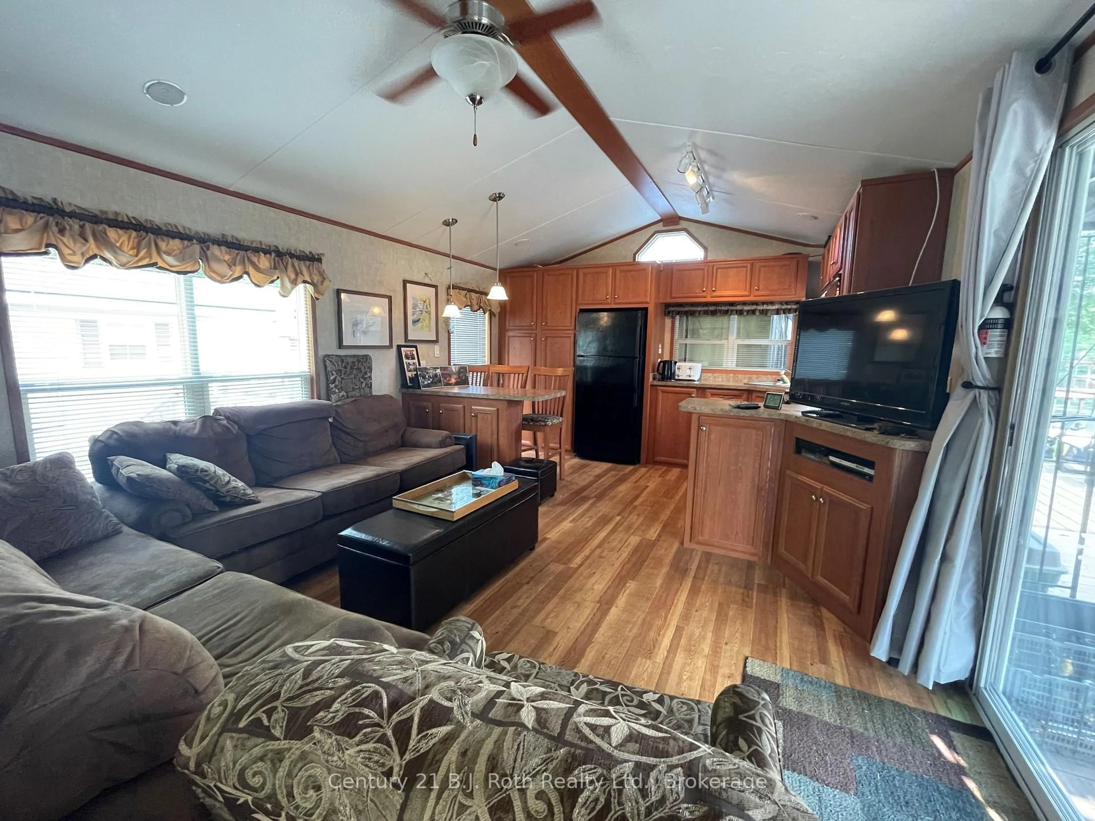 Living room with furniture, wood/laminate floor for 1336 SOUTH MORRISON LAKE Rd #51 Riverside Village, Gravenhurst Ontario P0E 1G0