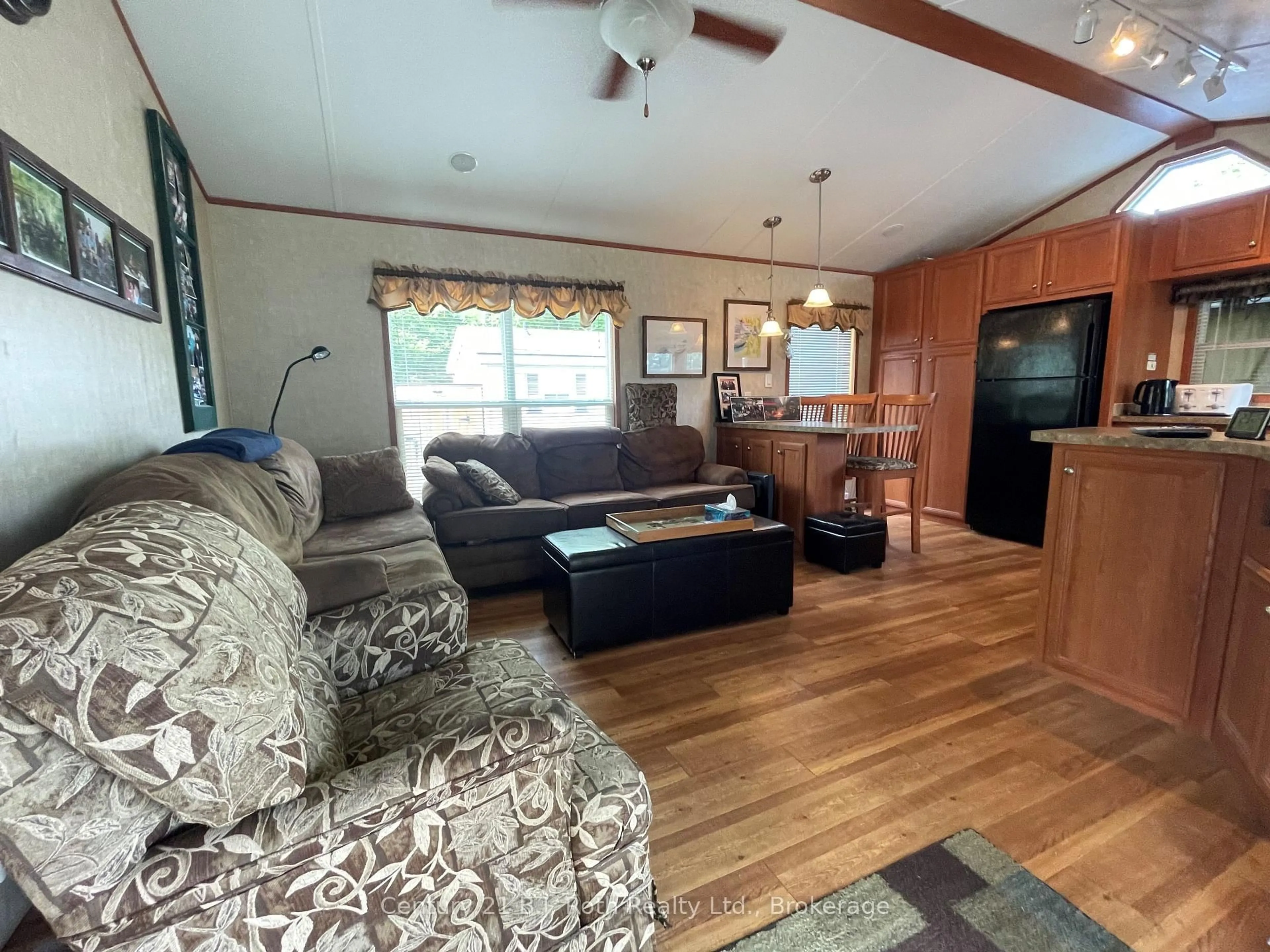 Living room with furniture, wood/laminate floor for 1336 SOUTH MORRISON LAKE Rd #51 Riverside Village, Gravenhurst Ontario P0E 1G0