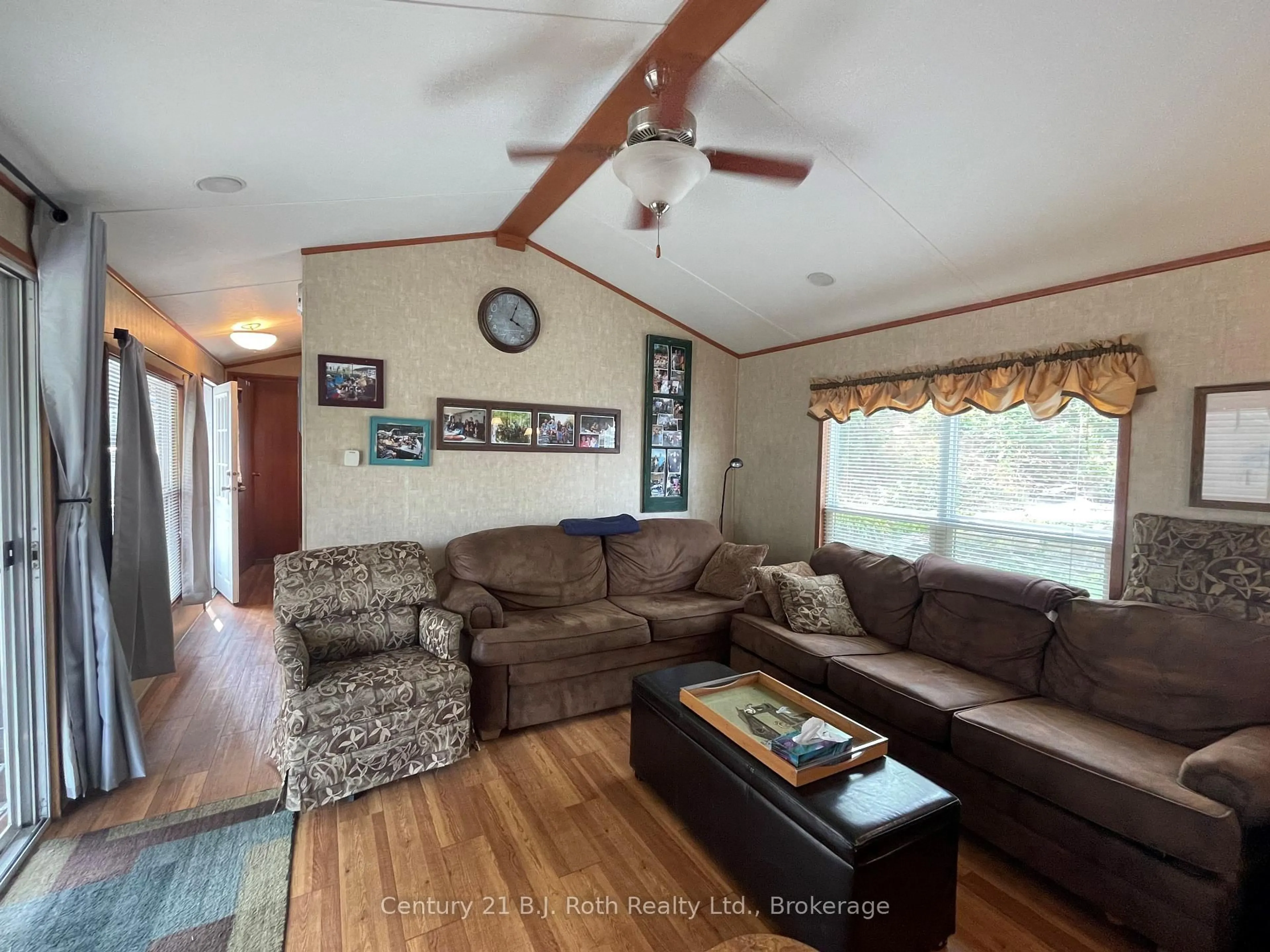 Living room with furniture, wood/laminate floor for 1336 SOUTH MORRISON LAKE Rd #51 Riverside Village, Gravenhurst Ontario P0E 1G0