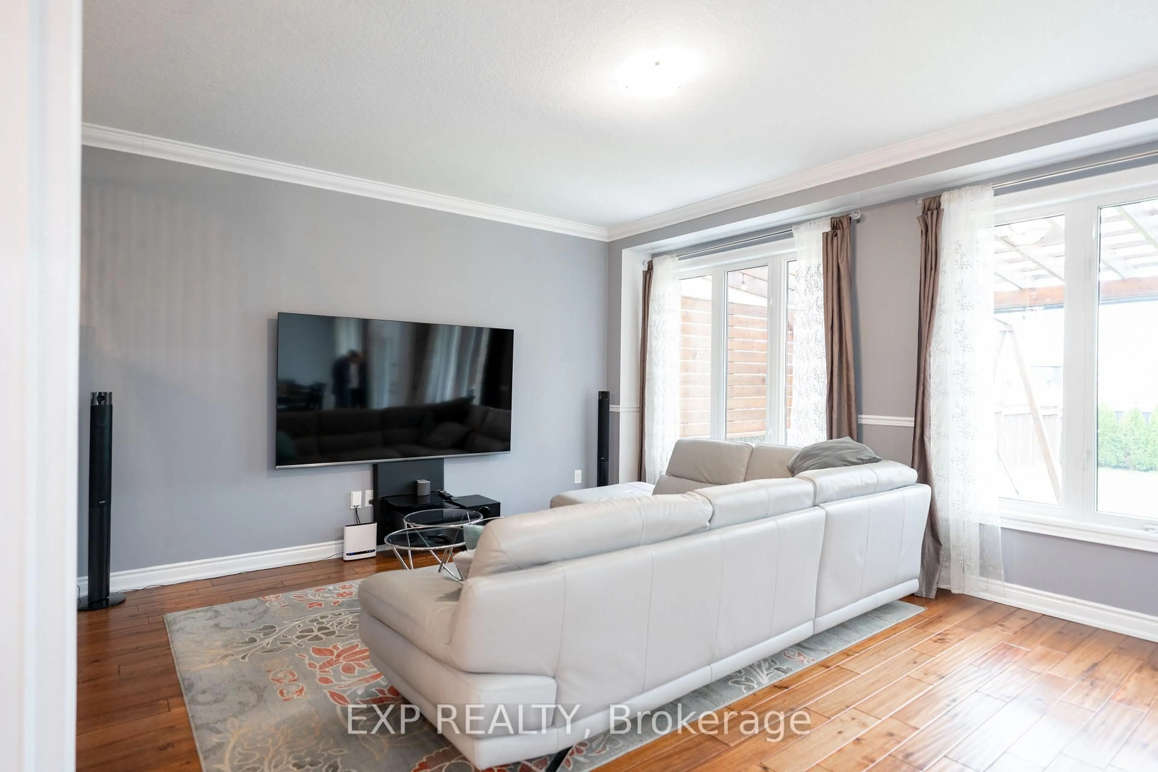 Living room with furniture, wood/laminate floor for 8375 ELDERBERRY Dr, Niagara Falls Ontario L2H 0K6