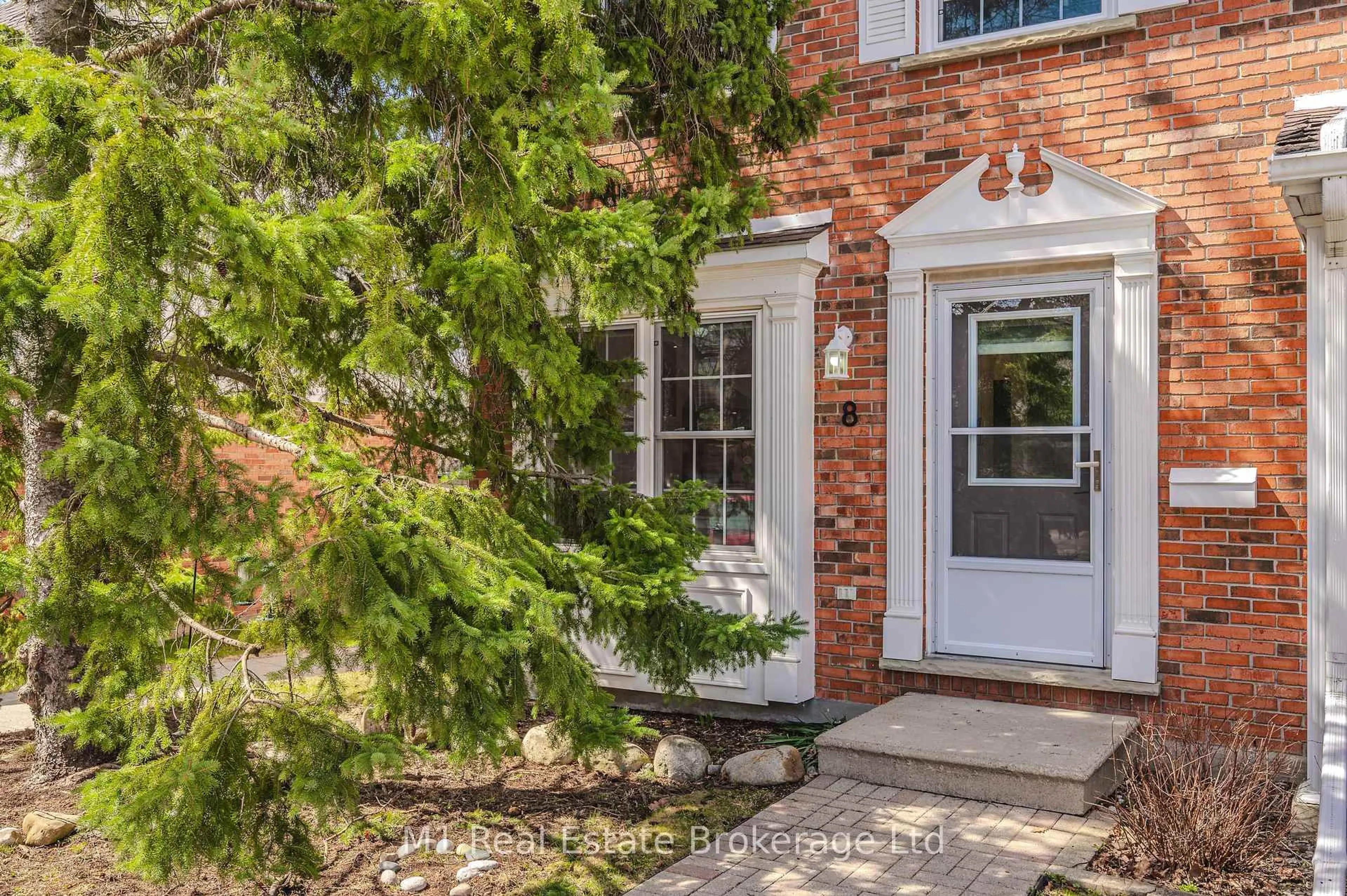 Home with brick exterior material, street for 129 VICTORIA Rd #8, Guelph Ontario N1E 6V3