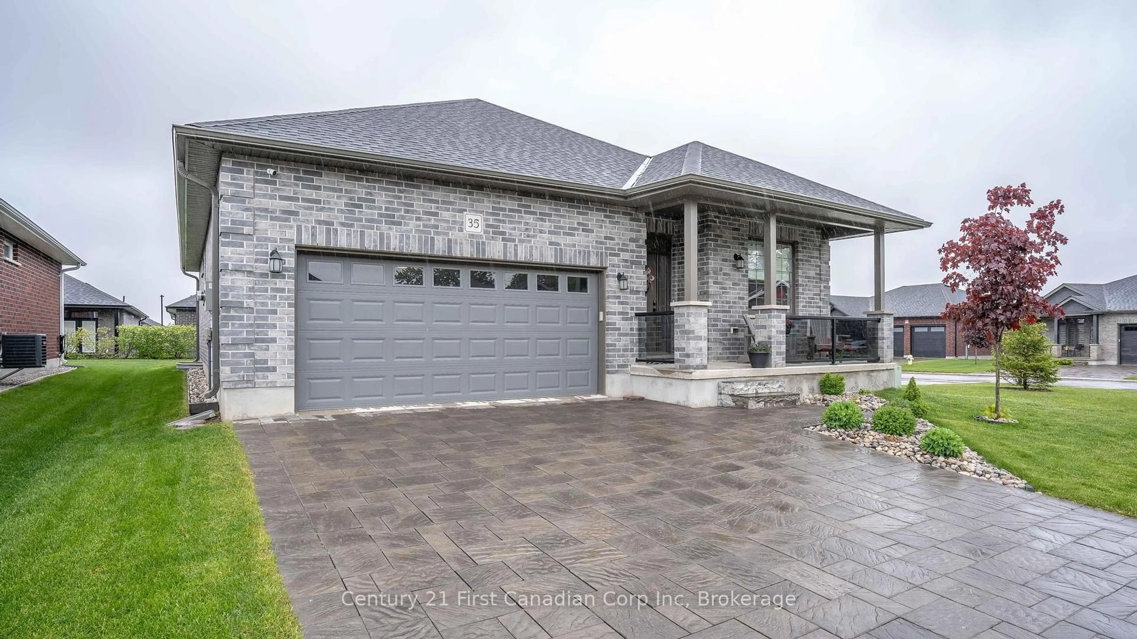 Home with brick exterior material, street for 121 Robin Ridge Dr #35, Central Elgin Ontario L0L 1B0