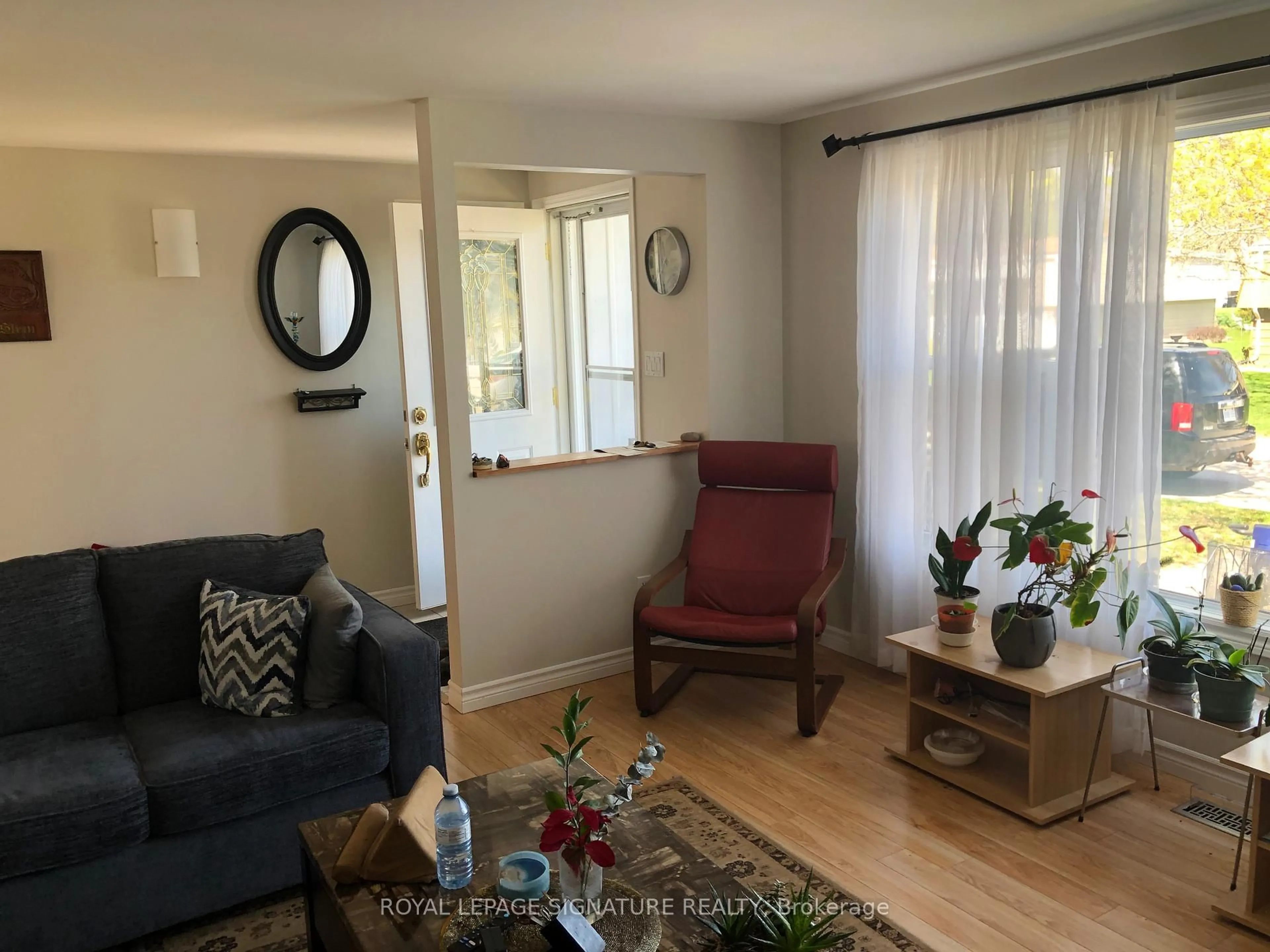 Living room with furniture, wood/laminate floor for 330 Wyldwood Lane, Lambton Shores Ontario N0M 1T0