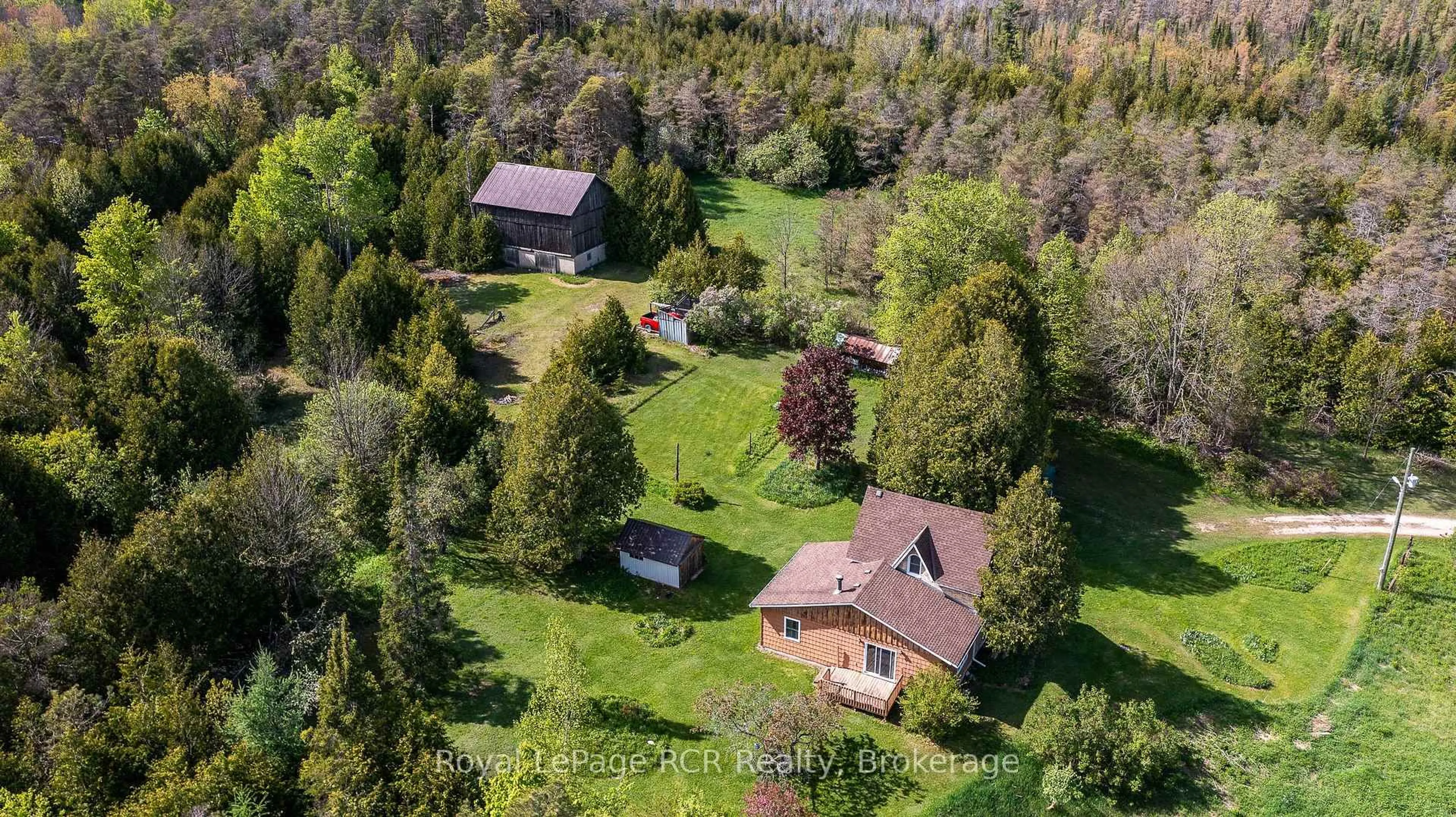 A pic from outside/outdoor area/front of a property/back of a property/a pic from drone, forest/trees view for 134780 20 Sdrd, West Grey Ontario N0G 1L0