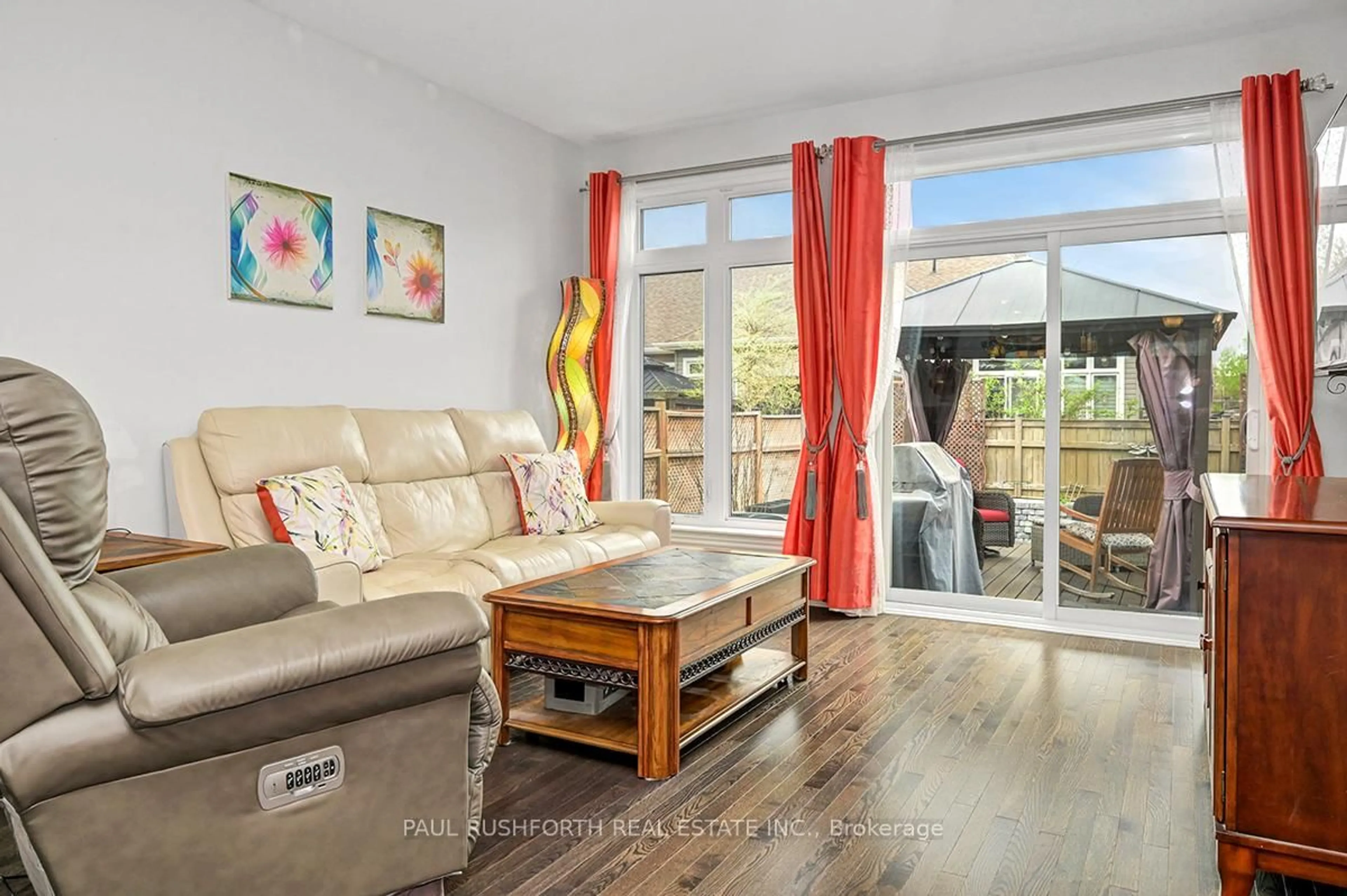 Living room with furniture, wood/laminate floor for 552 Silverbell Cres, Ottawa Ontario K1T 0P1