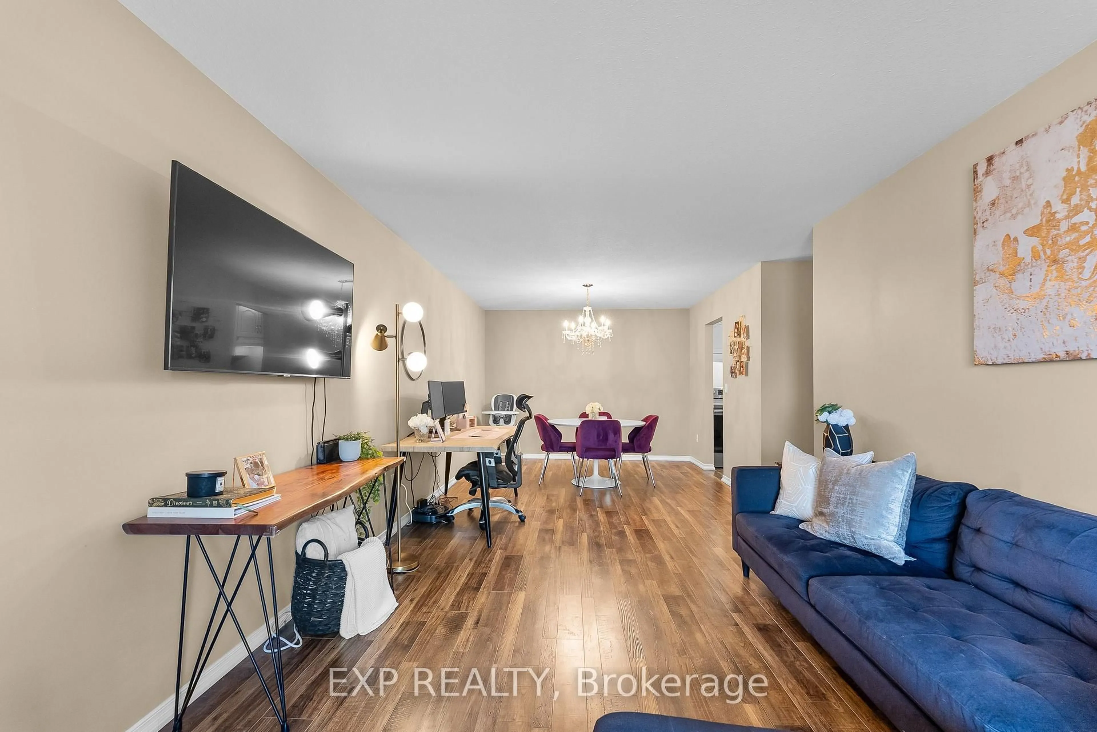 Living room with furniture, wood/laminate floor for 117 Willson Rd #12, Welland Ontario L3C 2T4