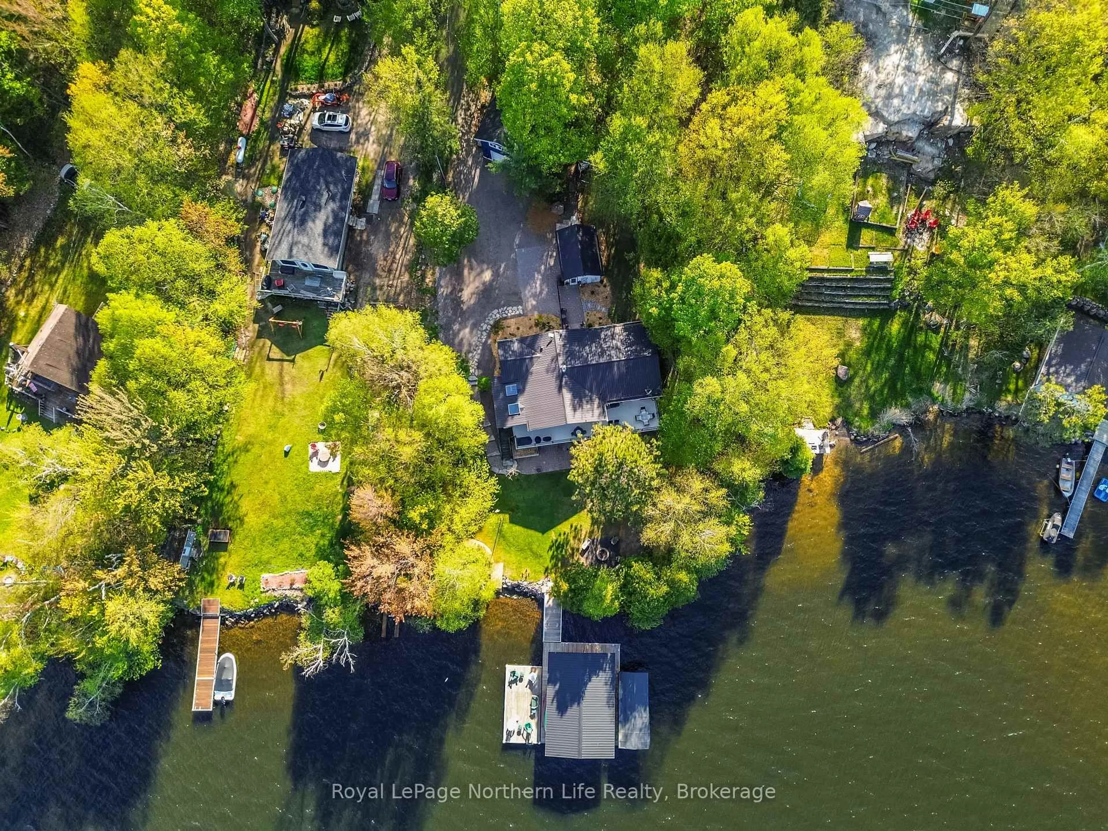 A pic from outside/outdoor area/front of a property/back of a property/a pic from drone, water/lake/river/ocean view for 84 Kyle Rd, East Ferris Ontario P0H 1K0