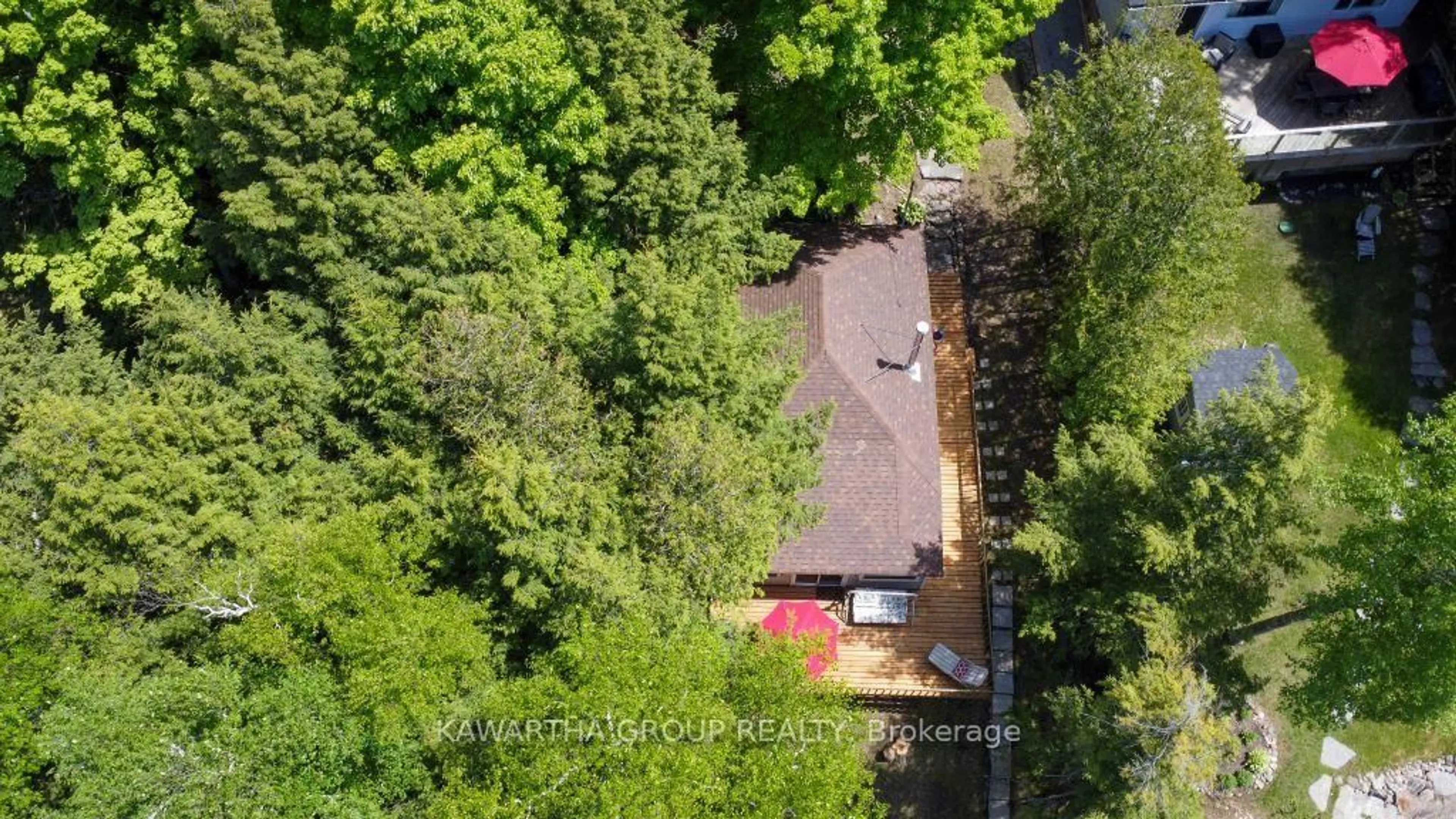 A pic from outside/outdoor area/front of a property/back of a property/a pic from drone, forest/trees view for 44 Birch Glen Dr, Kawartha Lakes Ontario K0M 1C0