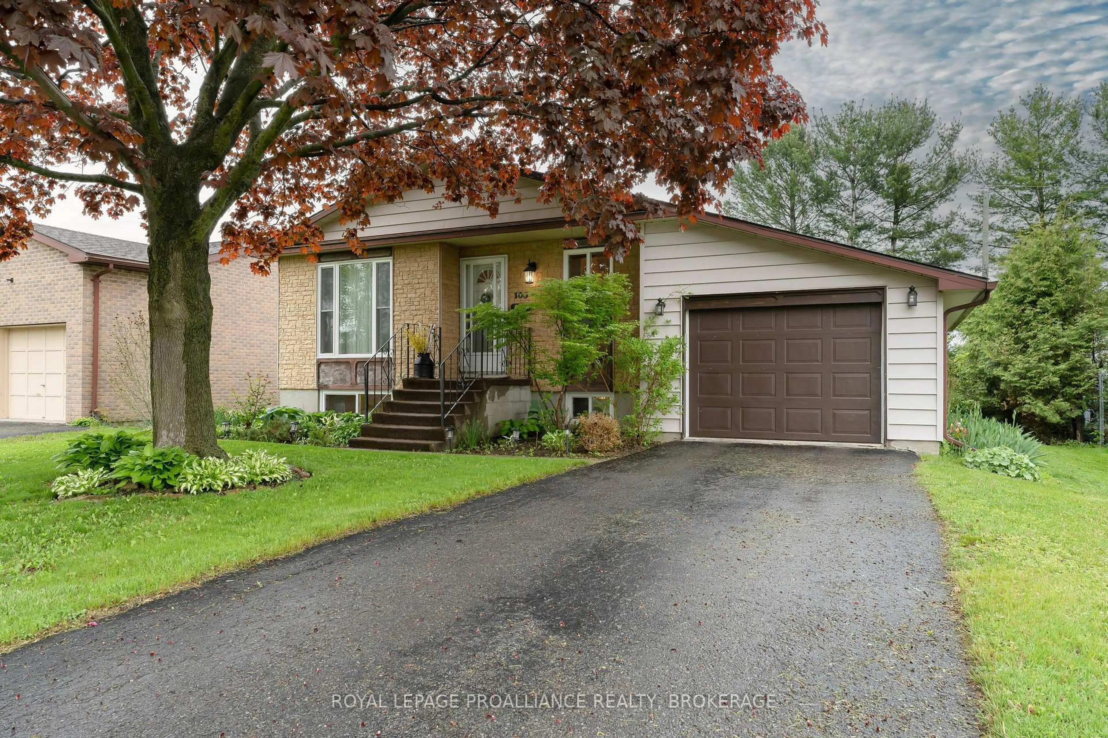 Home with vinyl exterior material, street for 103 Elmwood Dr, Gananoque Ontario K7G 3A5