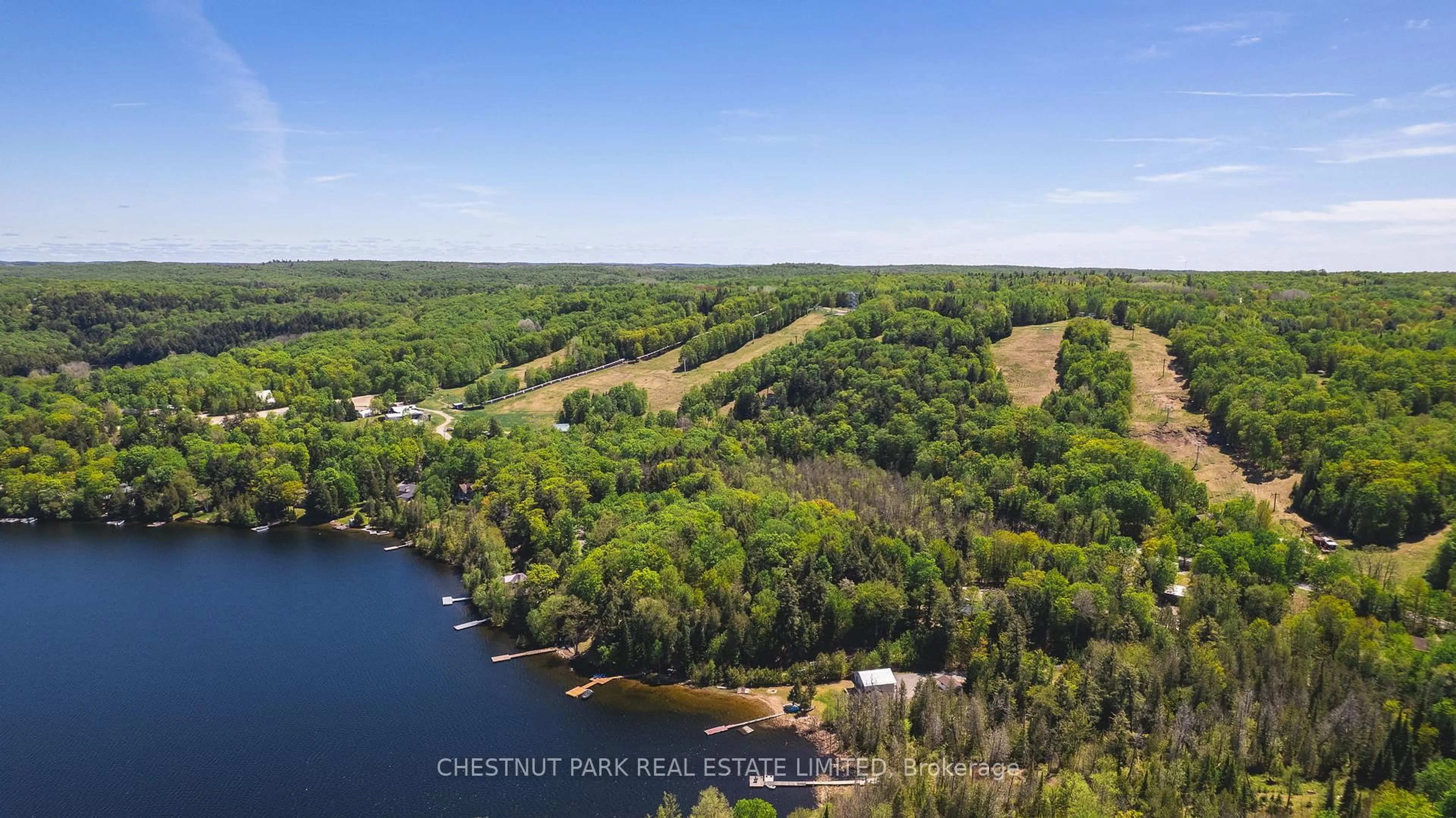 A pic from outside/outdoor area/front of a property/back of a property/a pic from drone, water/lake/river/ocean view for 1316 Sir Sam's Rd, Dysart et al Ontario K0M 1M0