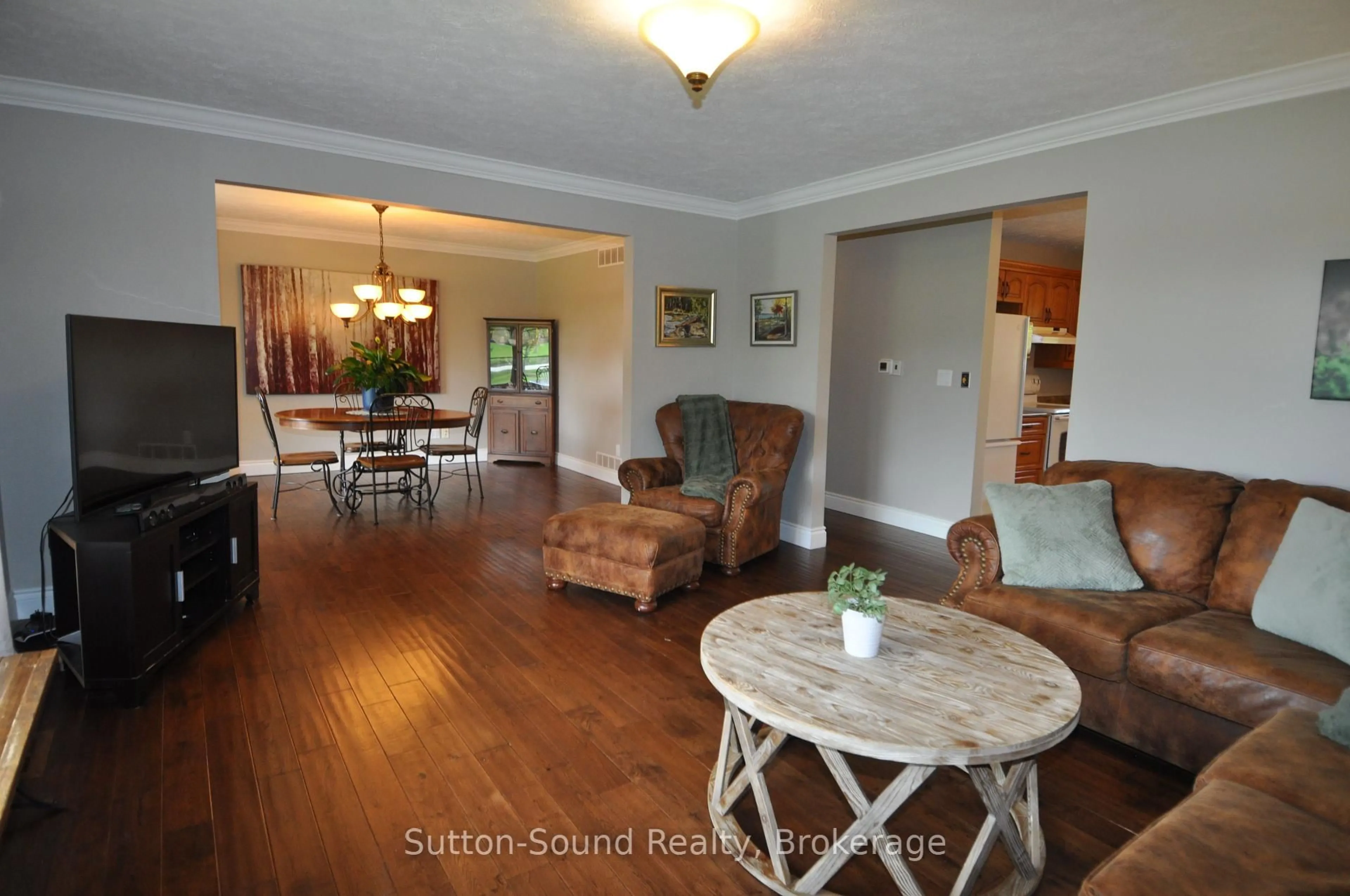 Living room with furniture, wood/laminate floor for 243097 Side Road 21 Sdrd, Meaford Ontario N4K 5N3
