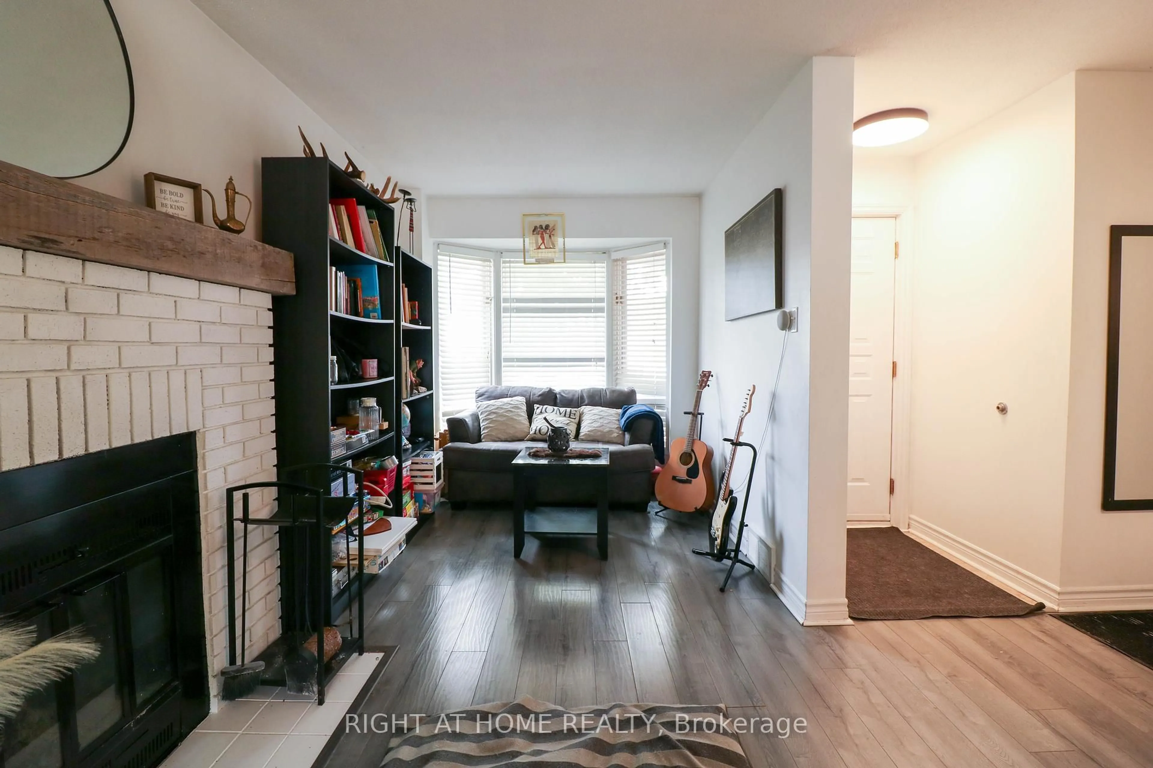 Living room with furniture, wood/laminate floor for 40 Stable Way, Kanata Ontario K2M 1A6
