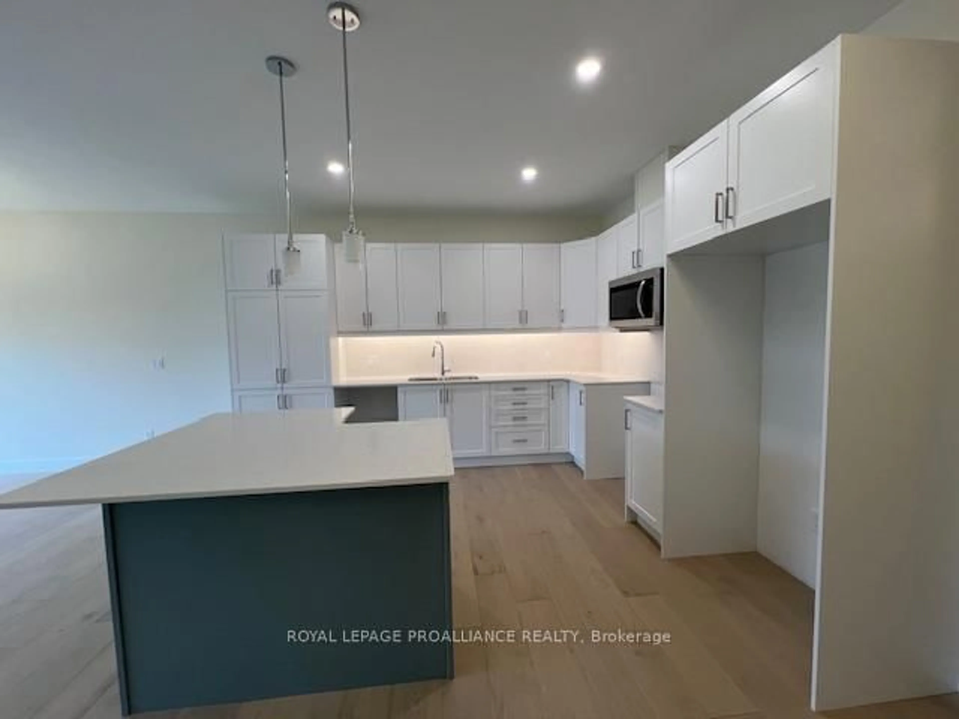 Open concept kitchen, wood/laminate floor for 22 Douglas Marshall Cres, Brockville Ontario K6V 0E7