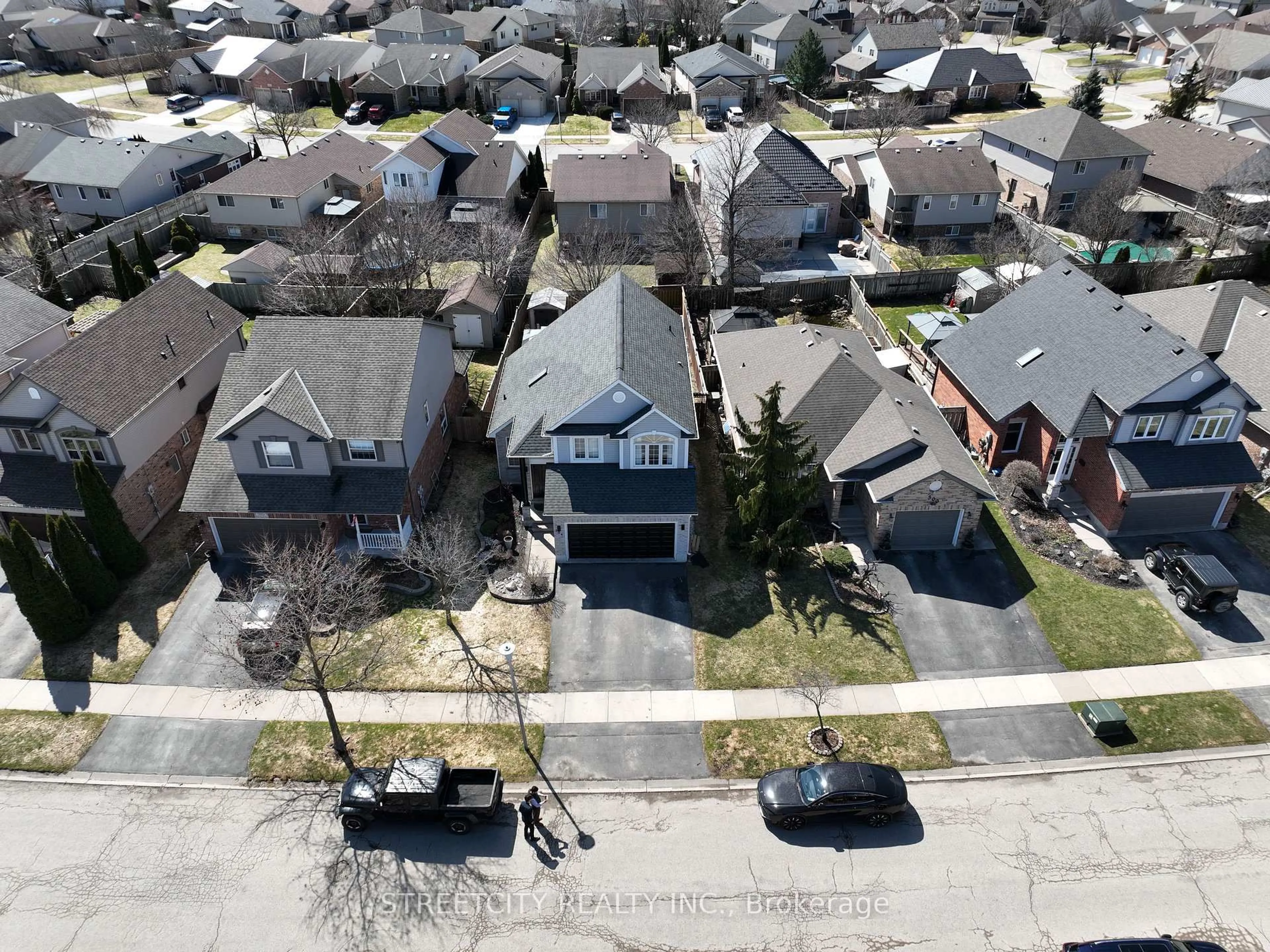 A pic from outside/outdoor area/front of a property/back of a property/a pic from drone, street for 304 White Sands Dr, London South Ontario N6M 1J2