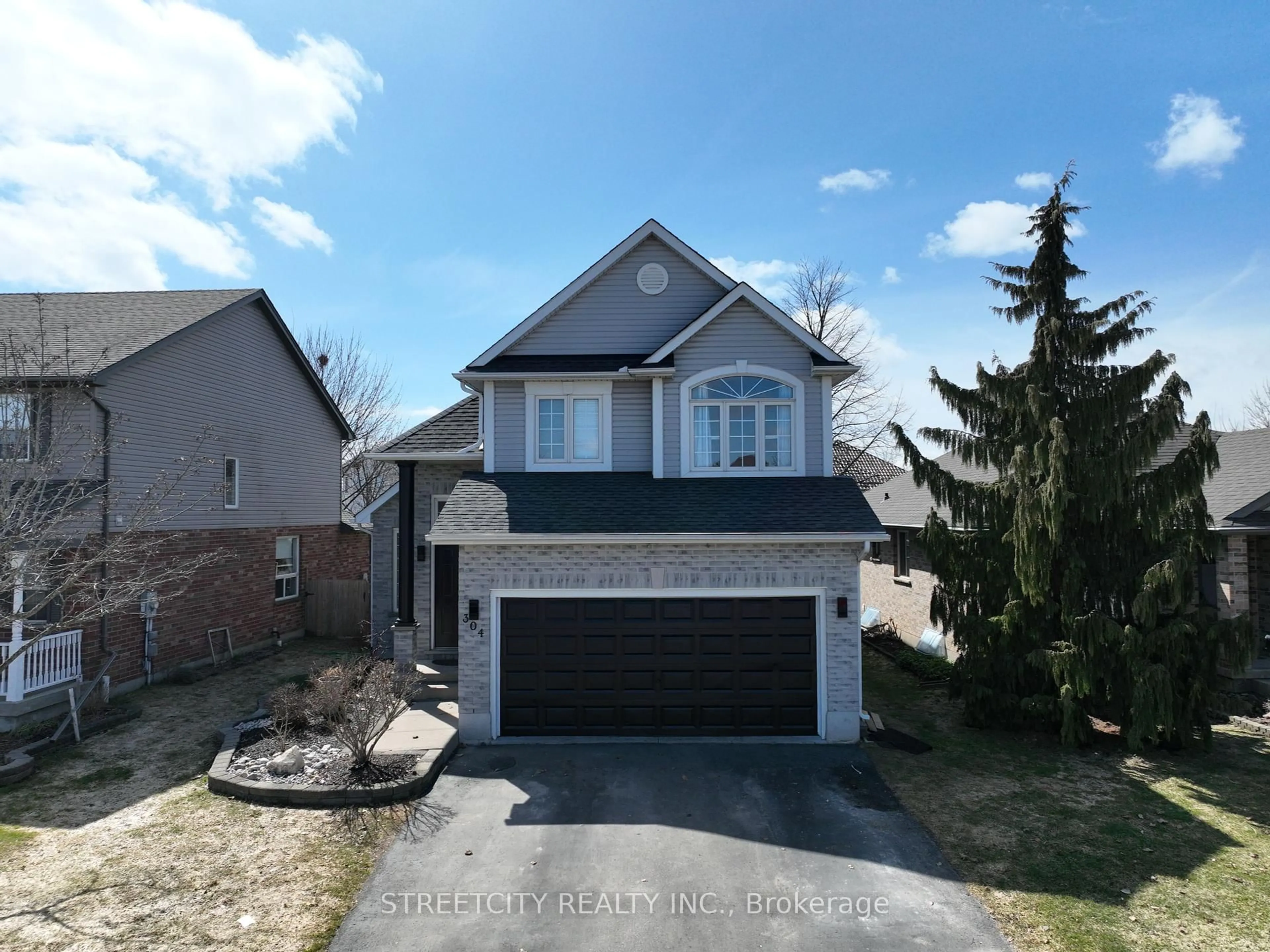 A pic from outside/outdoor area/front of a property/back of a property/a pic from drone, street for 304 White Sands Dr, London South Ontario N6M 1J2