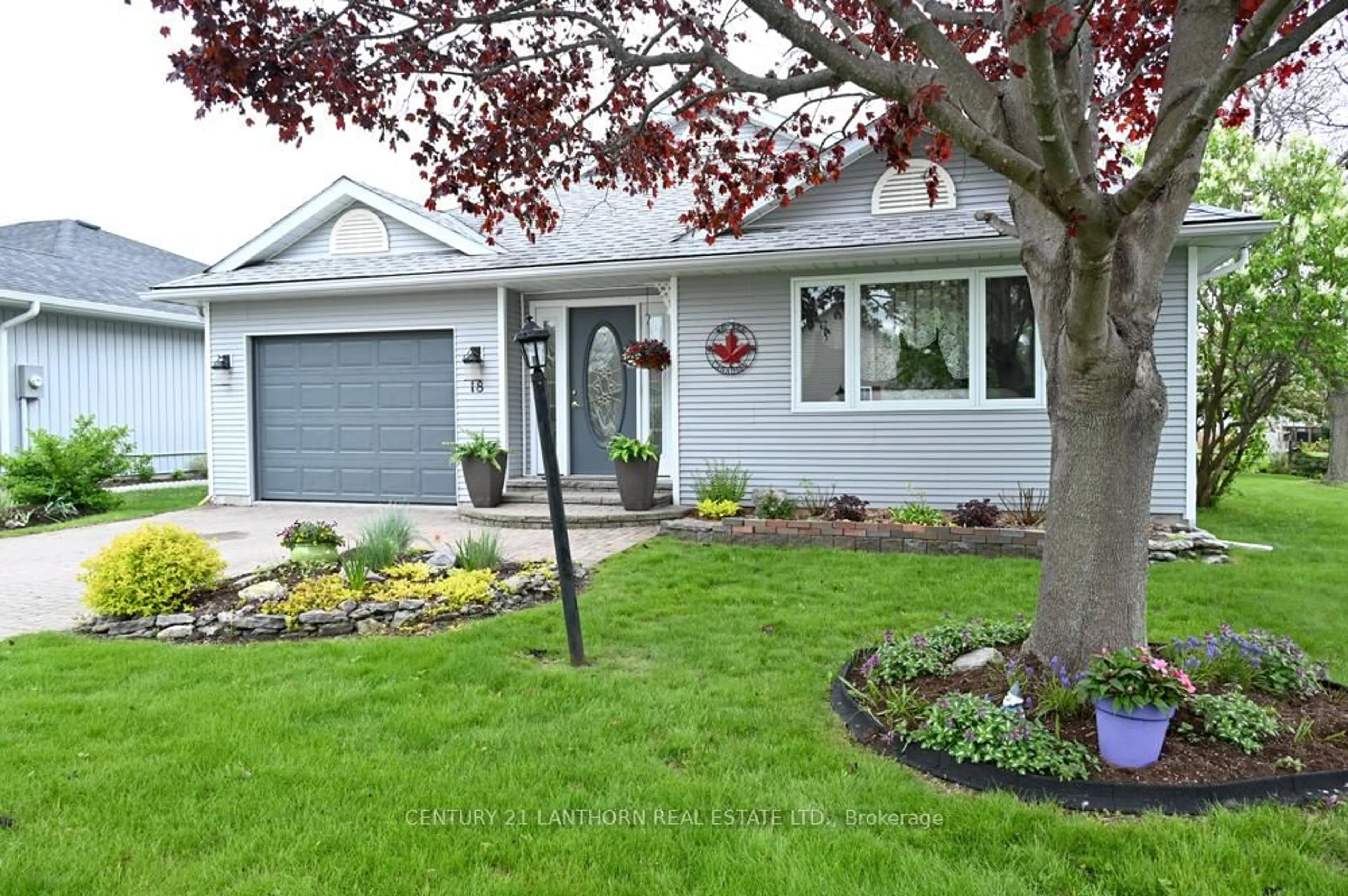 Home with vinyl exterior material, street for 18 Cretney Dr, Prince Edward County Ontario K0K 3L0