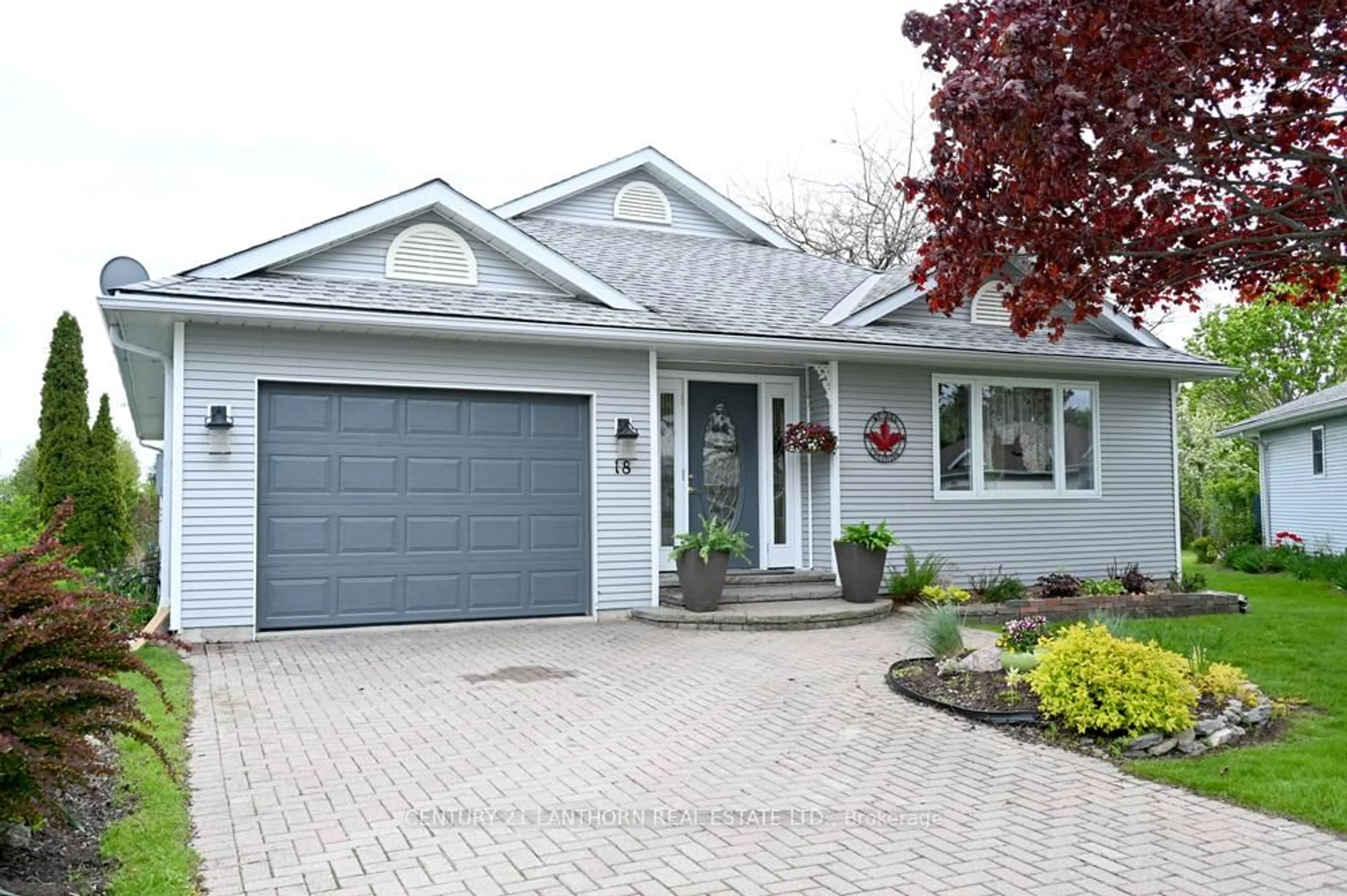 Home with vinyl exterior material, street for 18 Cretney Dr, Prince Edward County Ontario K0K 3L0