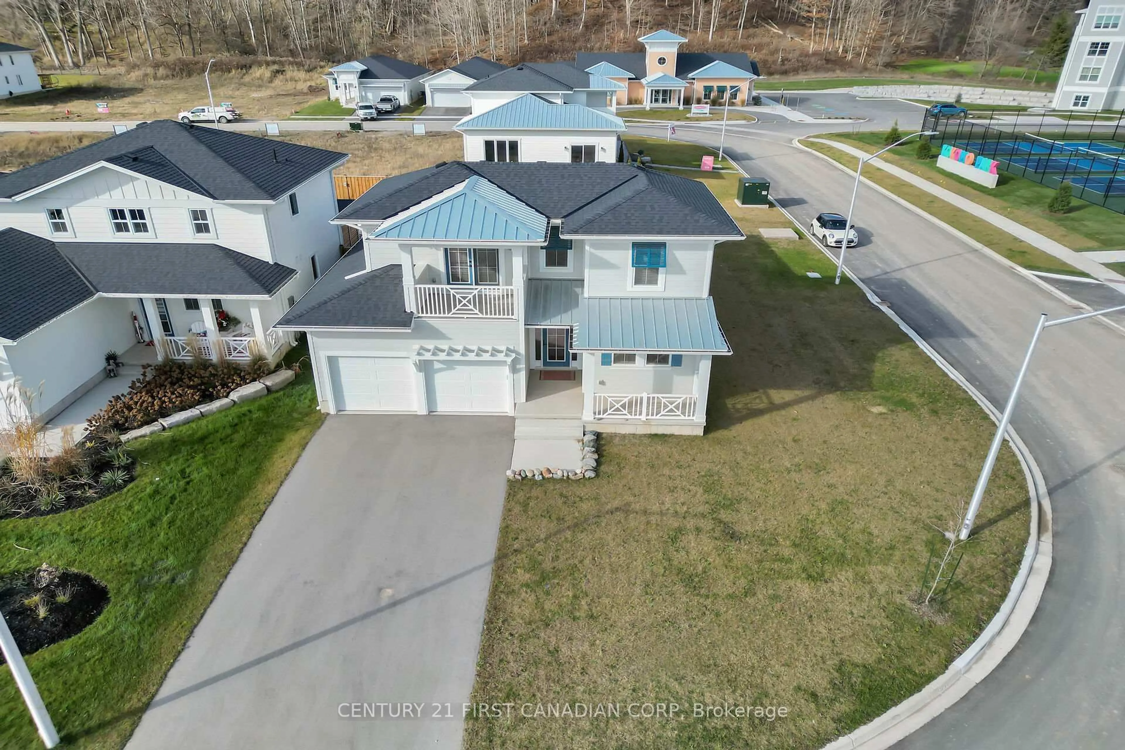 A pic from outside/outdoor area/front of a property/back of a property/a pic from drone, street for 403 Breakwater Blvd, Central Elgin Ontario N5L 0B5
