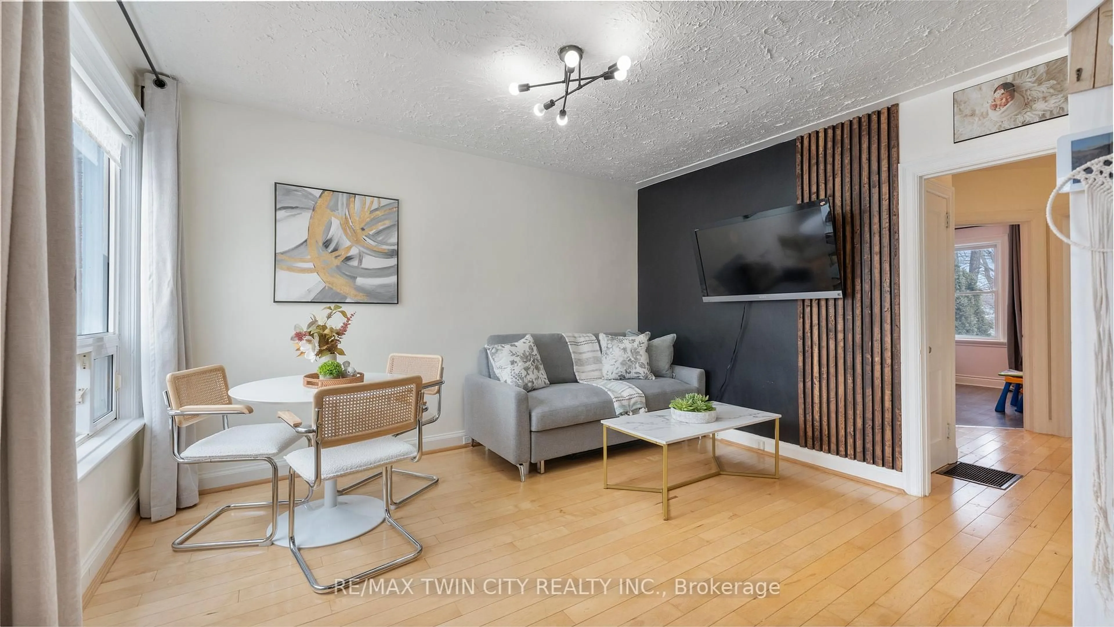 Living room with furniture, wood/laminate floor for 69 Lyons Ave, Brantford Ontario N3R 4R2