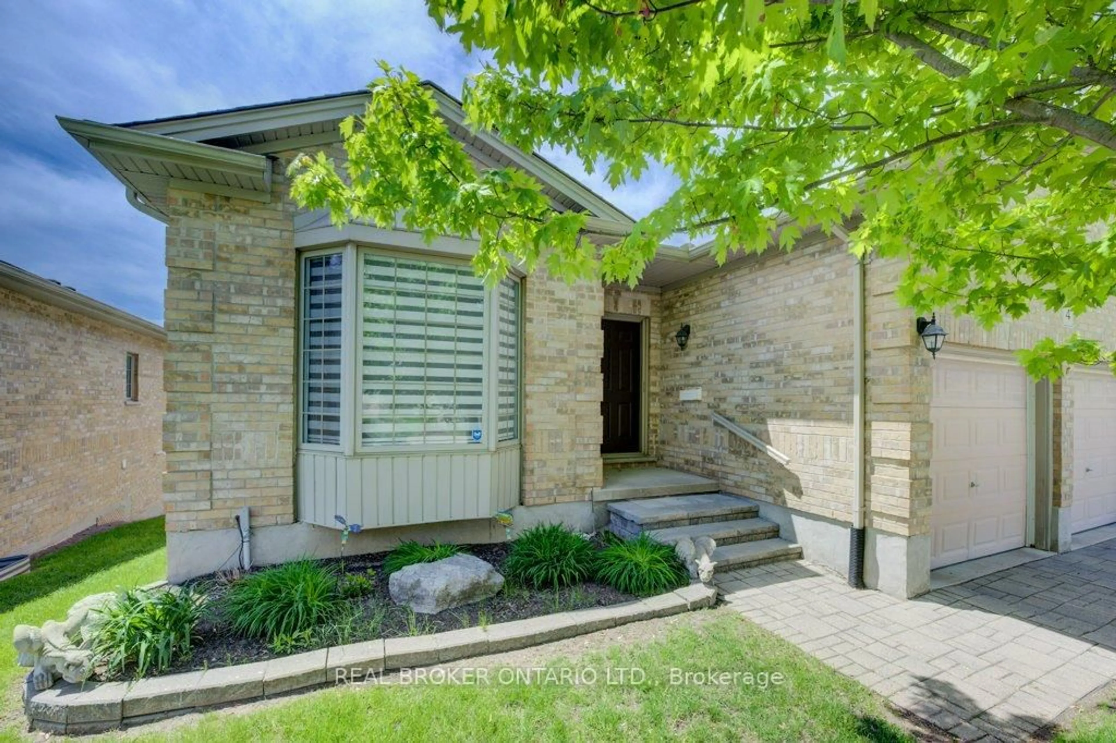Home with brick exterior material, street for 900 Doon Village Rd #4, Kitchener Ontario N2P 1A4