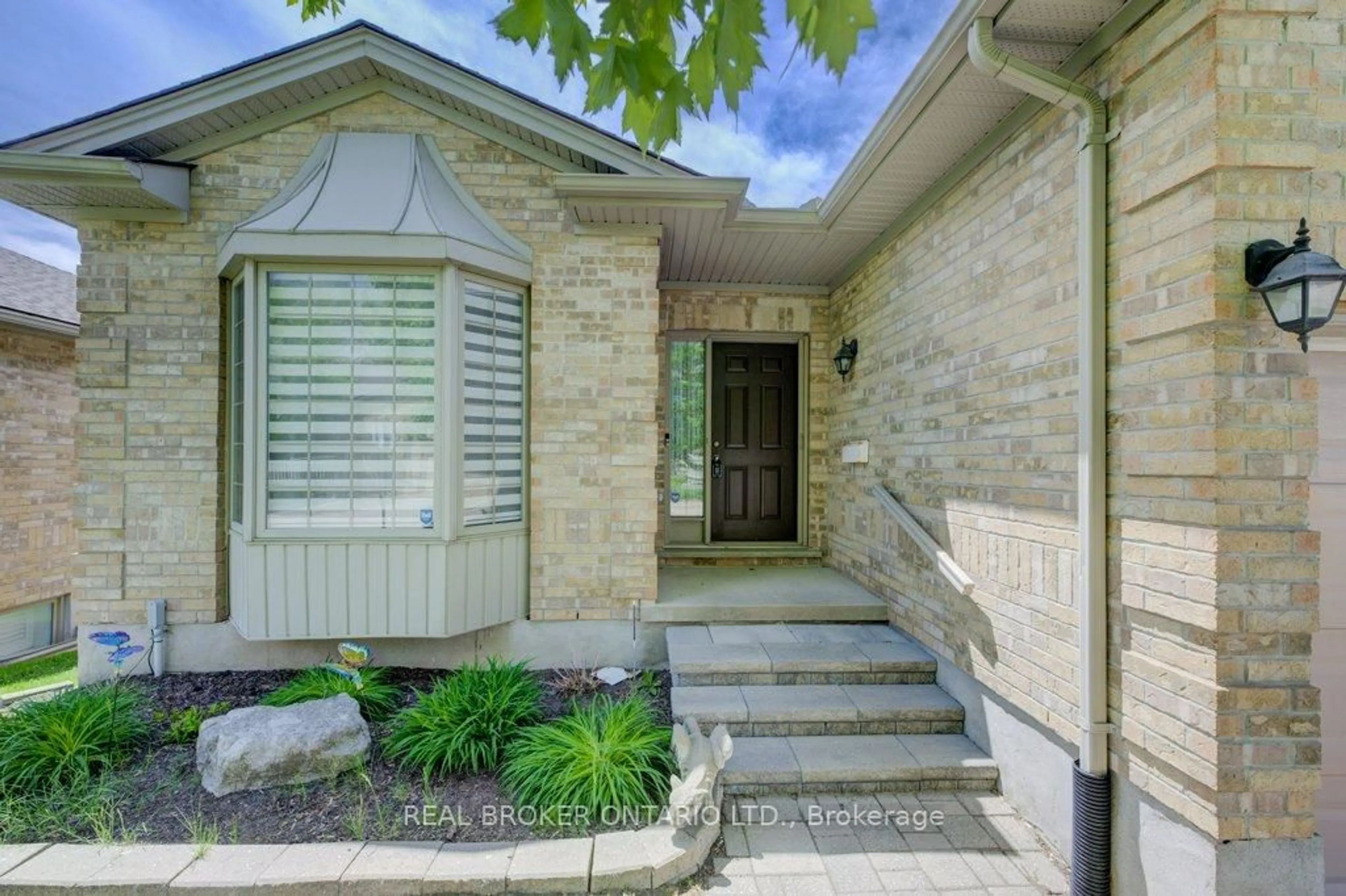 Home with brick exterior material, street for 900 Doon Village Rd #4, Kitchener Ontario N2P 1A4