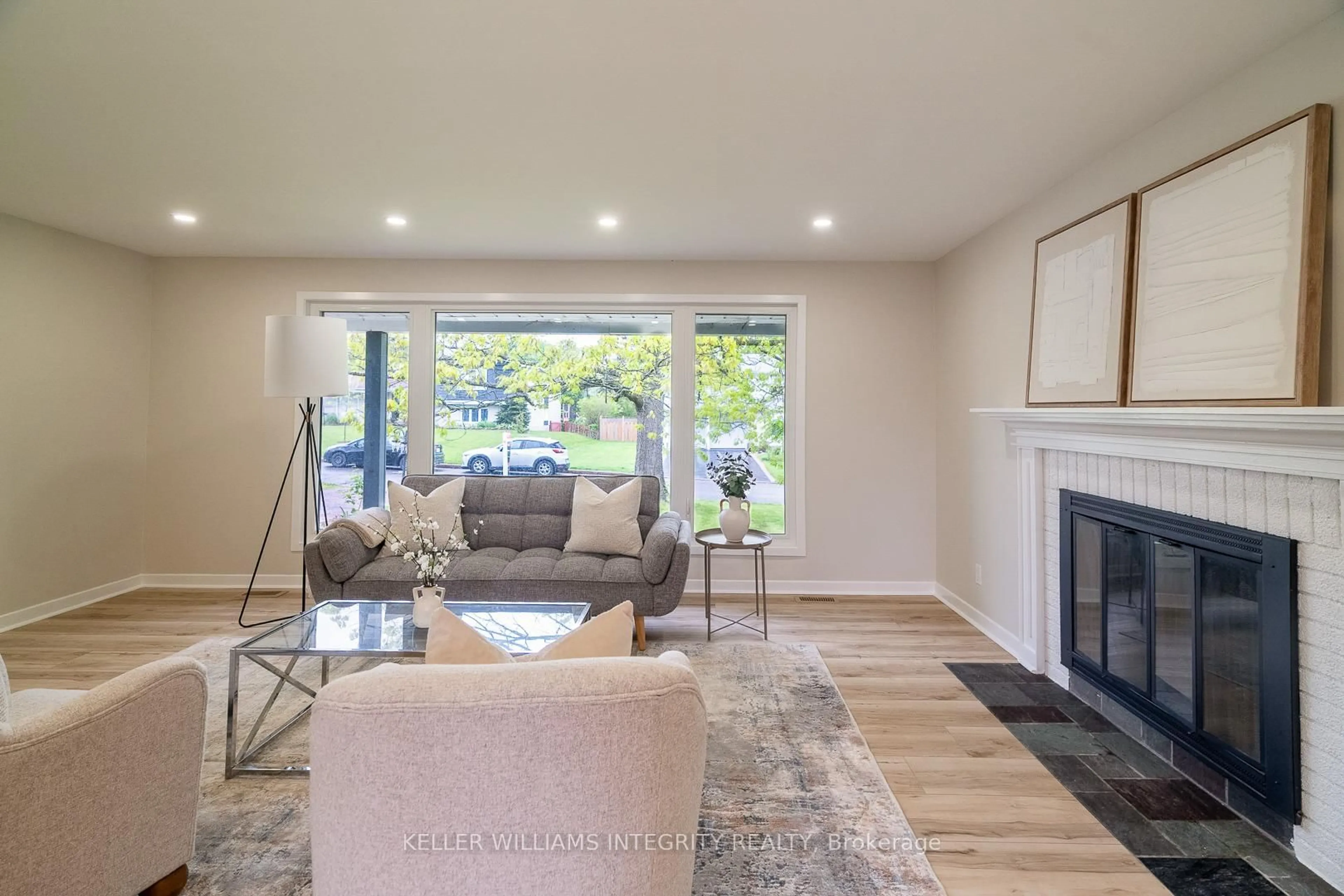 Living room with furniture, wood/laminate floor for 103 Beaver Rdge, Ottawa Ontario K2E 6E5