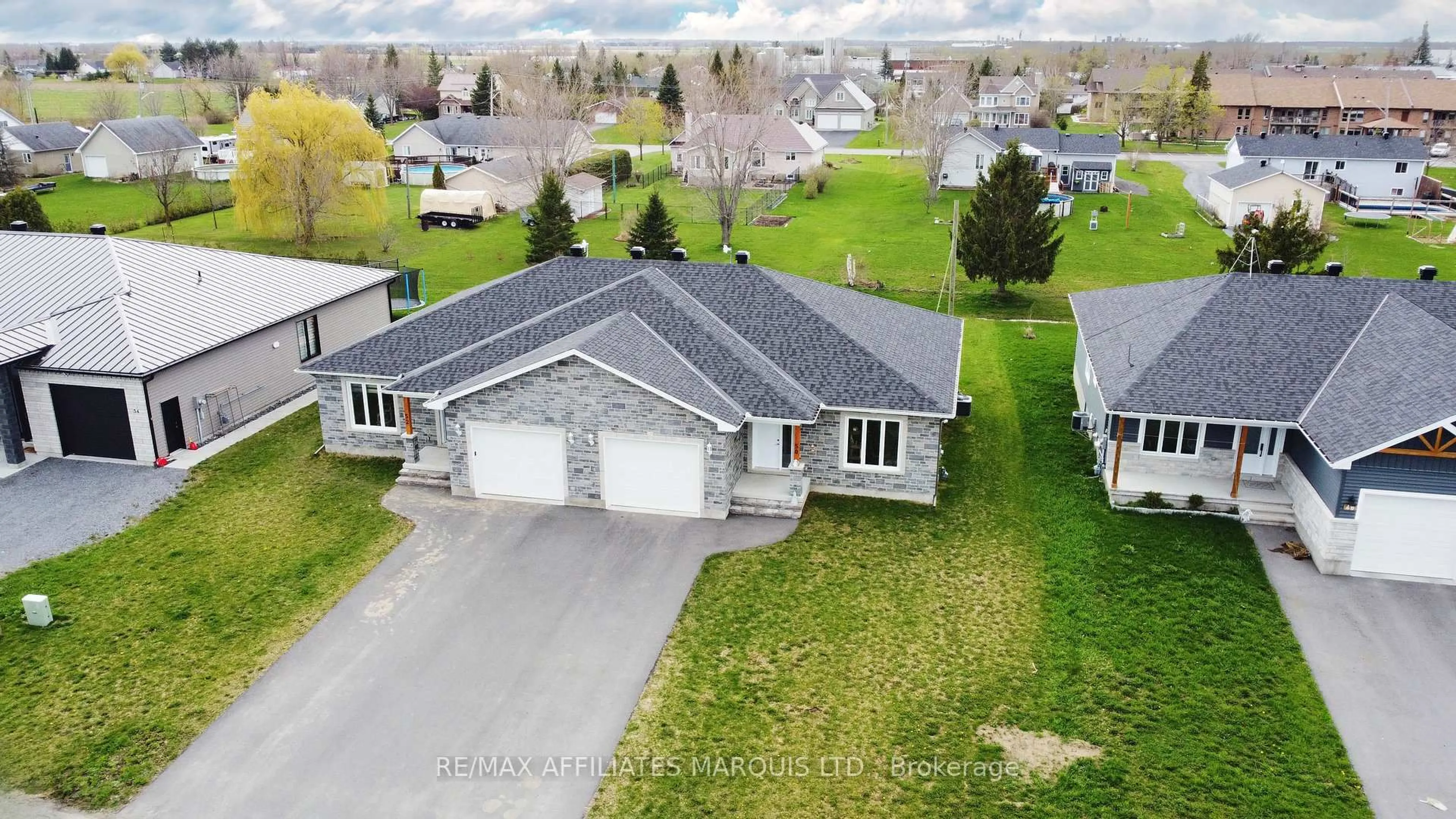 A pic from outside/outdoor area/front of a property/back of a property/a pic from drone, street for 50 ADAM St, The Nation Ontario K0A 3C0