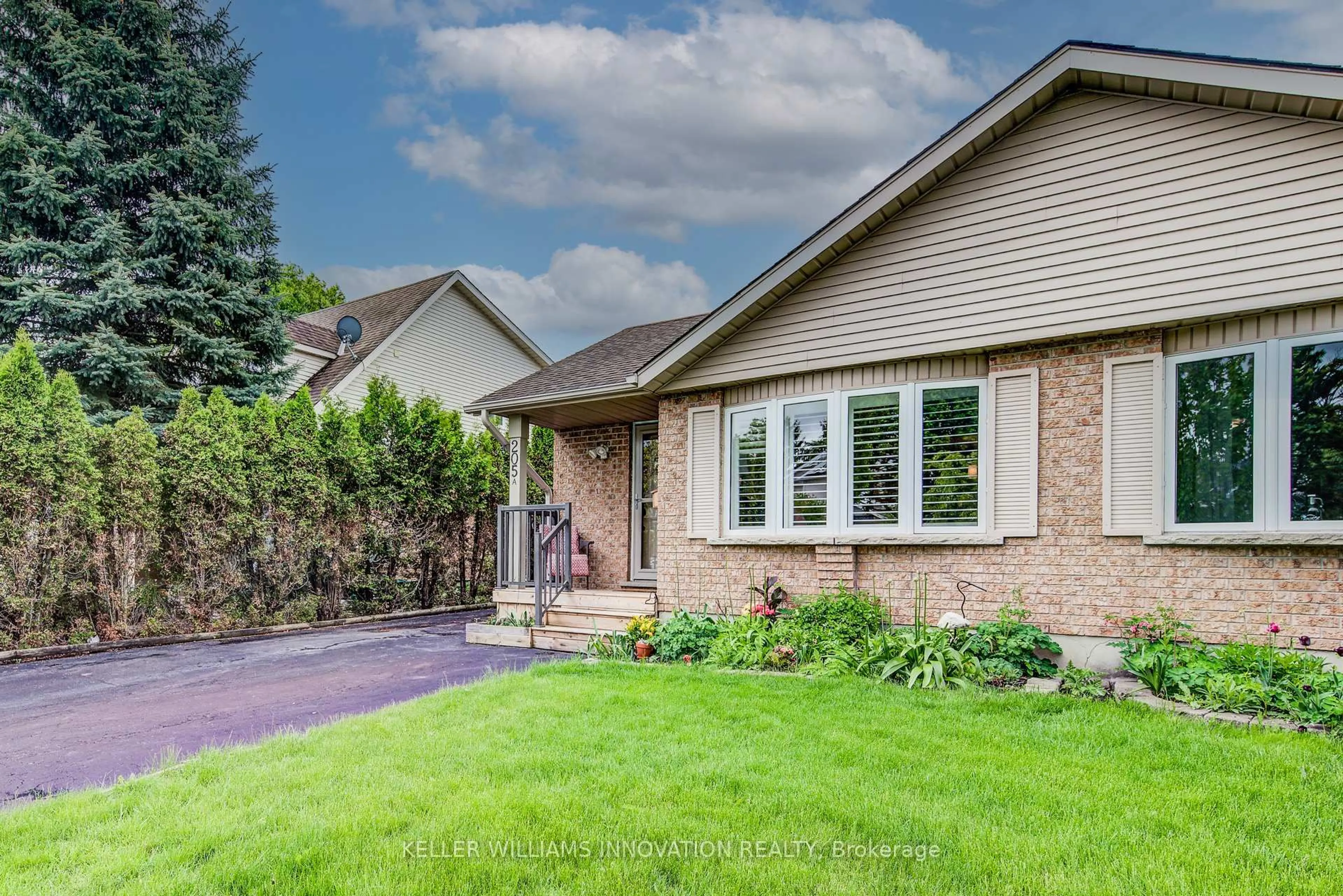 Home with brick exterior material, street for 205 AUBURN Dr #A, Waterloo Ontario N2K 3T1