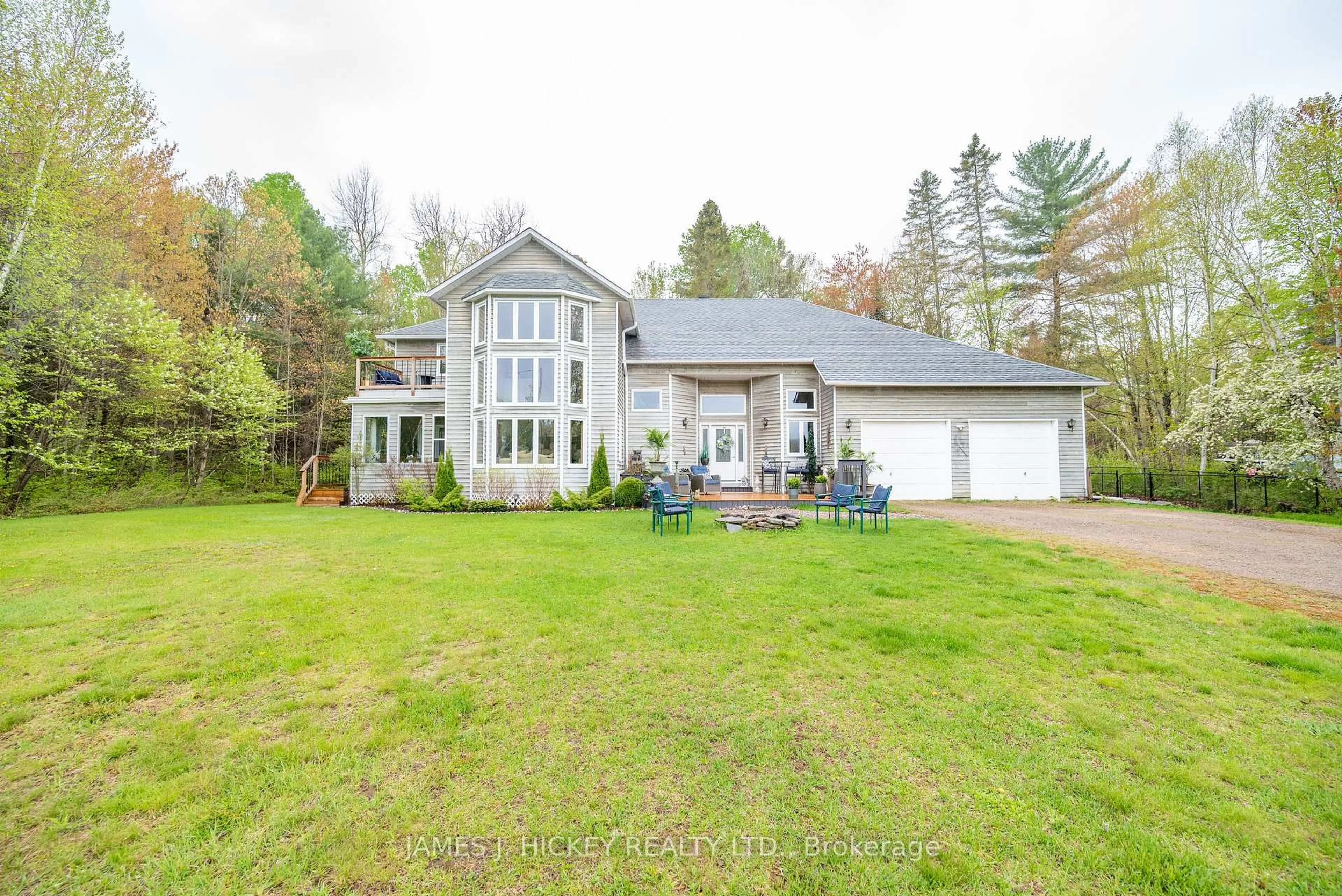 A pic from outside/outdoor area/front of a property/back of a property/a pic from drone, water/lake/river/ocean view for 107 Harvey Creek Rd, Mackey Ontario K0J 2B0