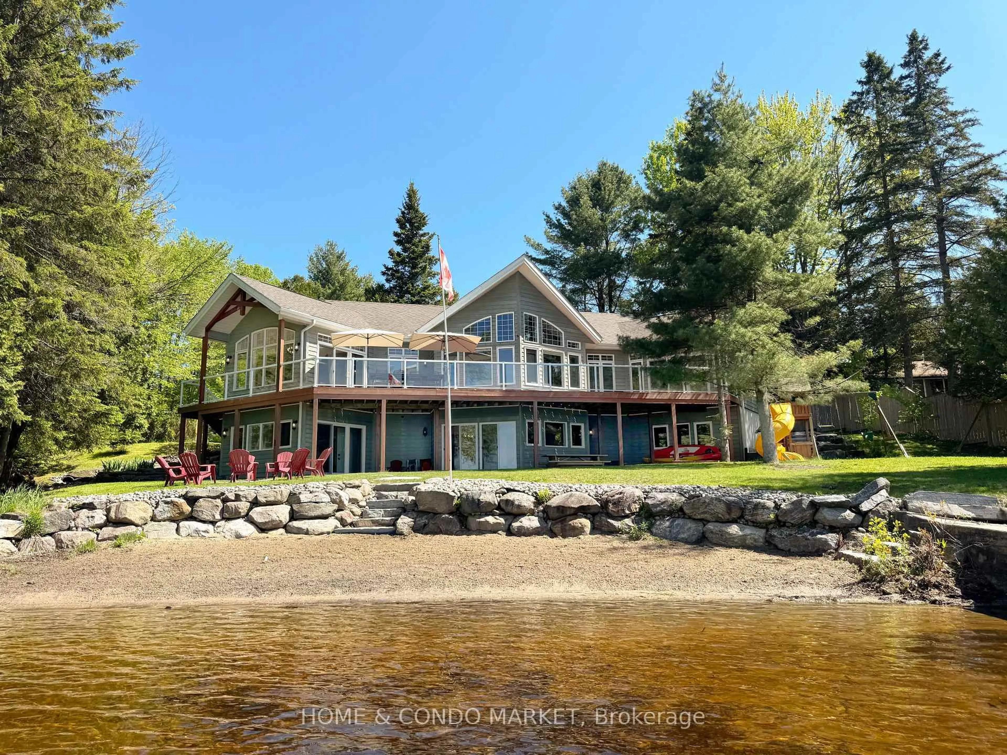 A pic from outside/outdoor area/front of a property/back of a property/a pic from drone, water/lake/river/ocean view for 14 Charles Ave, McKellar Ontario P2A 0B4
