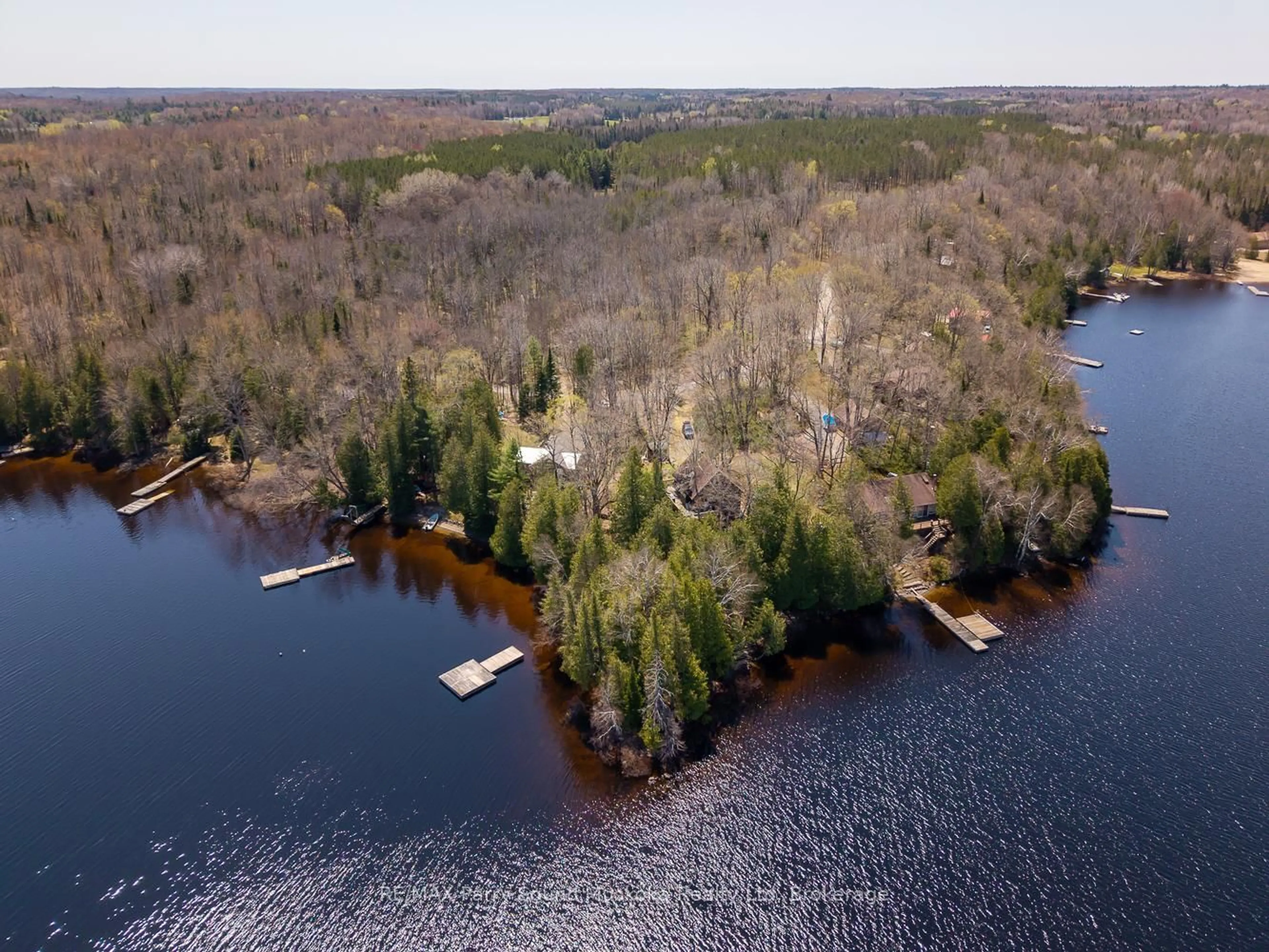 A pic from outside/outdoor area/front of a property/back of a property/a pic from drone, water/lake/river/ocean view for 24 Pine Grve, Whitestone Ontario P0A 1G0