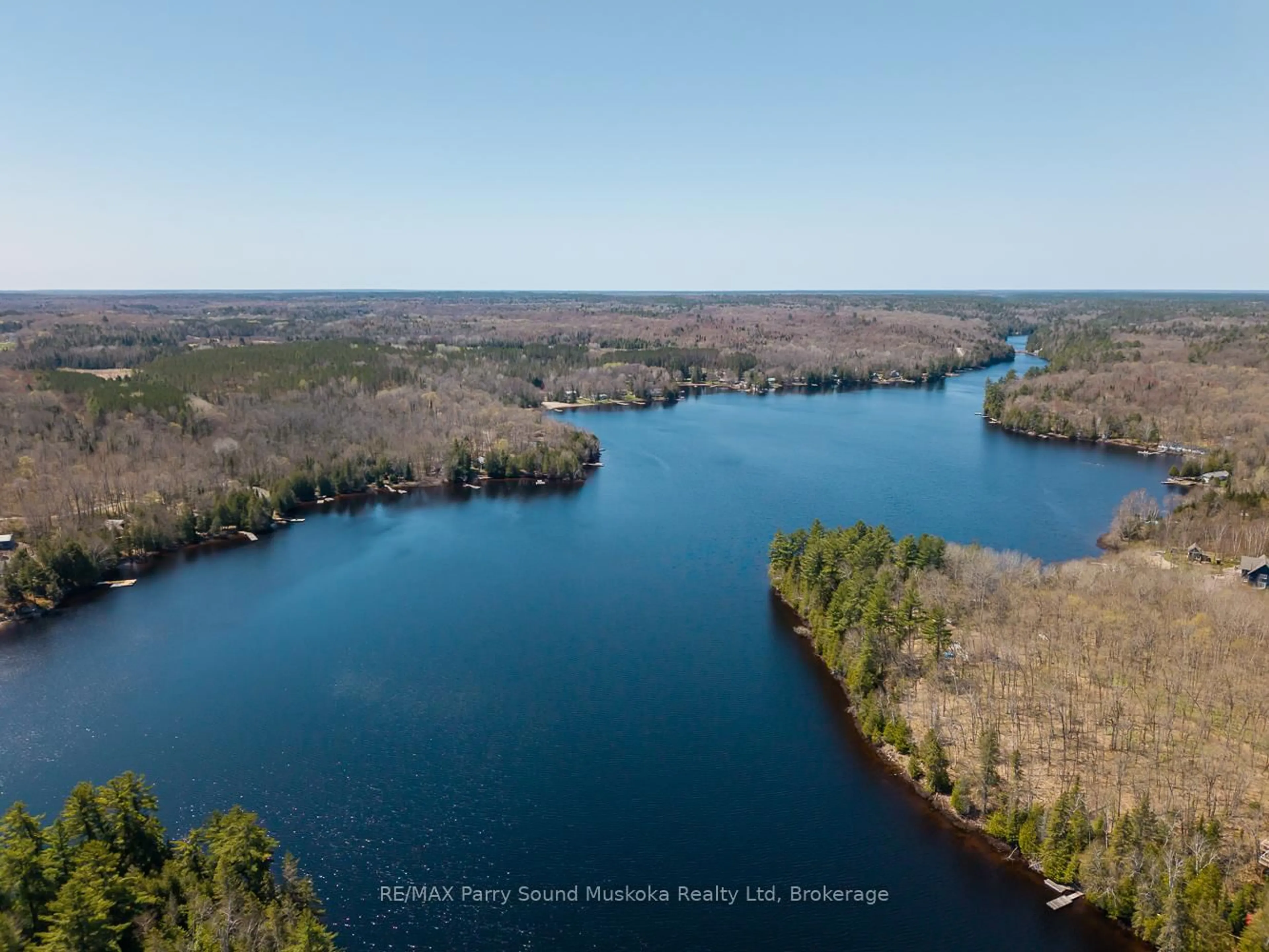 A pic from outside/outdoor area/front of a property/back of a property/a pic from drone, water/lake/river/ocean view for 24 Pine Grve, Whitestone Ontario P0A 1G0