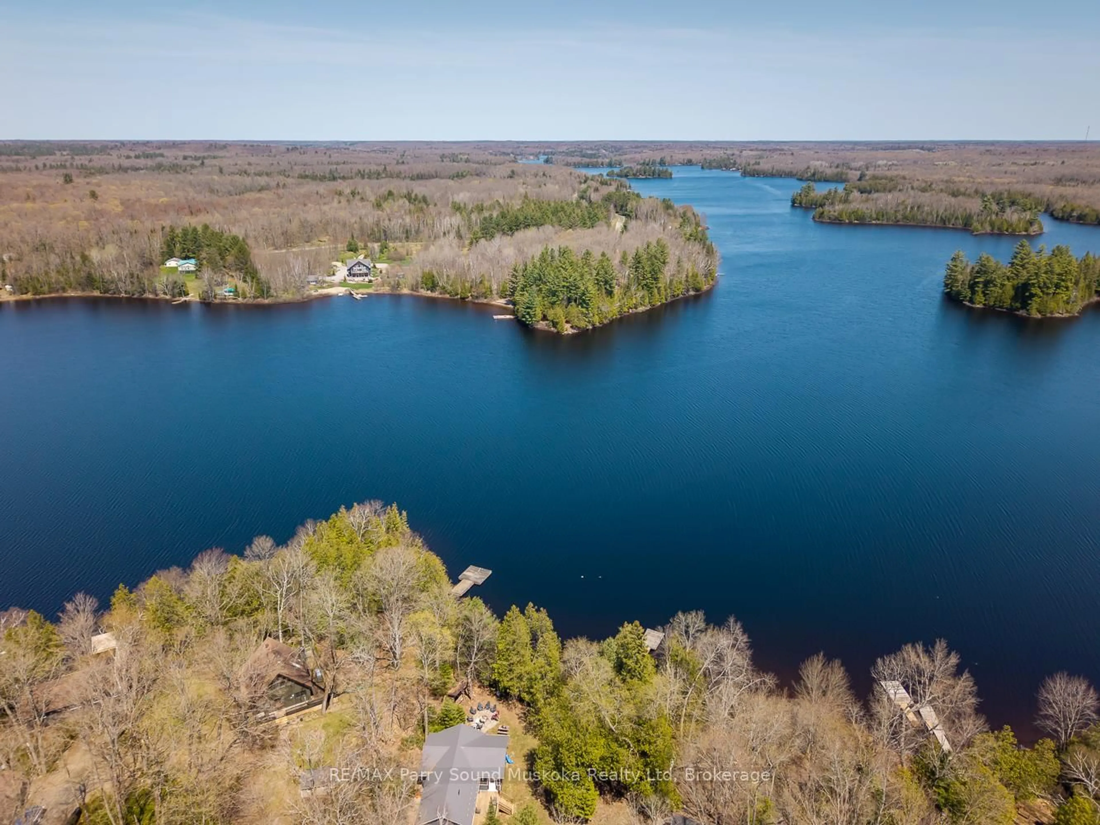 A pic from outside/outdoor area/front of a property/back of a property/a pic from drone, water/lake/river/ocean view for 24 Pine Grve, Whitestone Ontario P0A 1G0