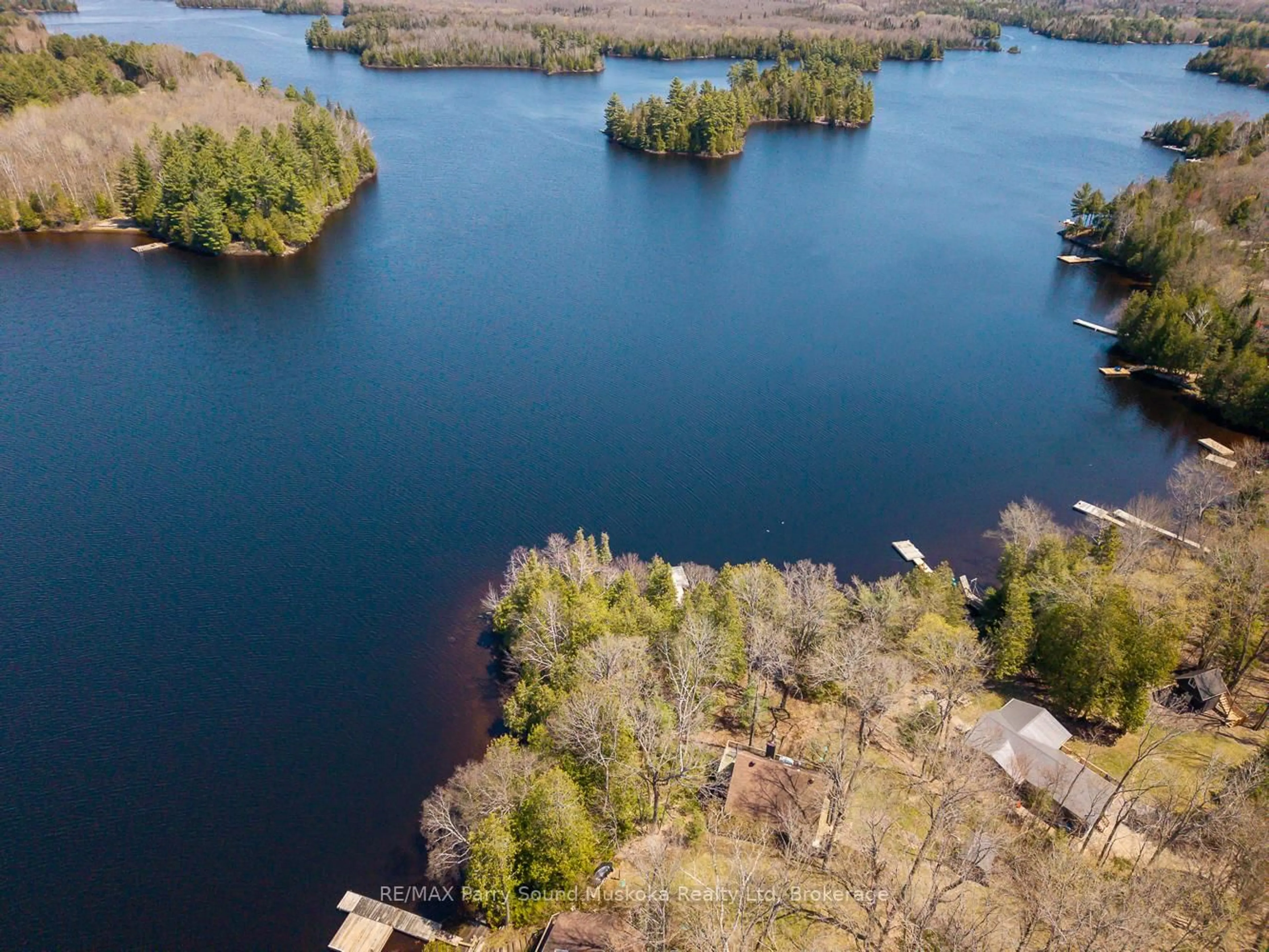 A pic from outside/outdoor area/front of a property/back of a property/a pic from drone, water/lake/river/ocean view for 24 Pine Grve, Whitestone Ontario P0A 1G0