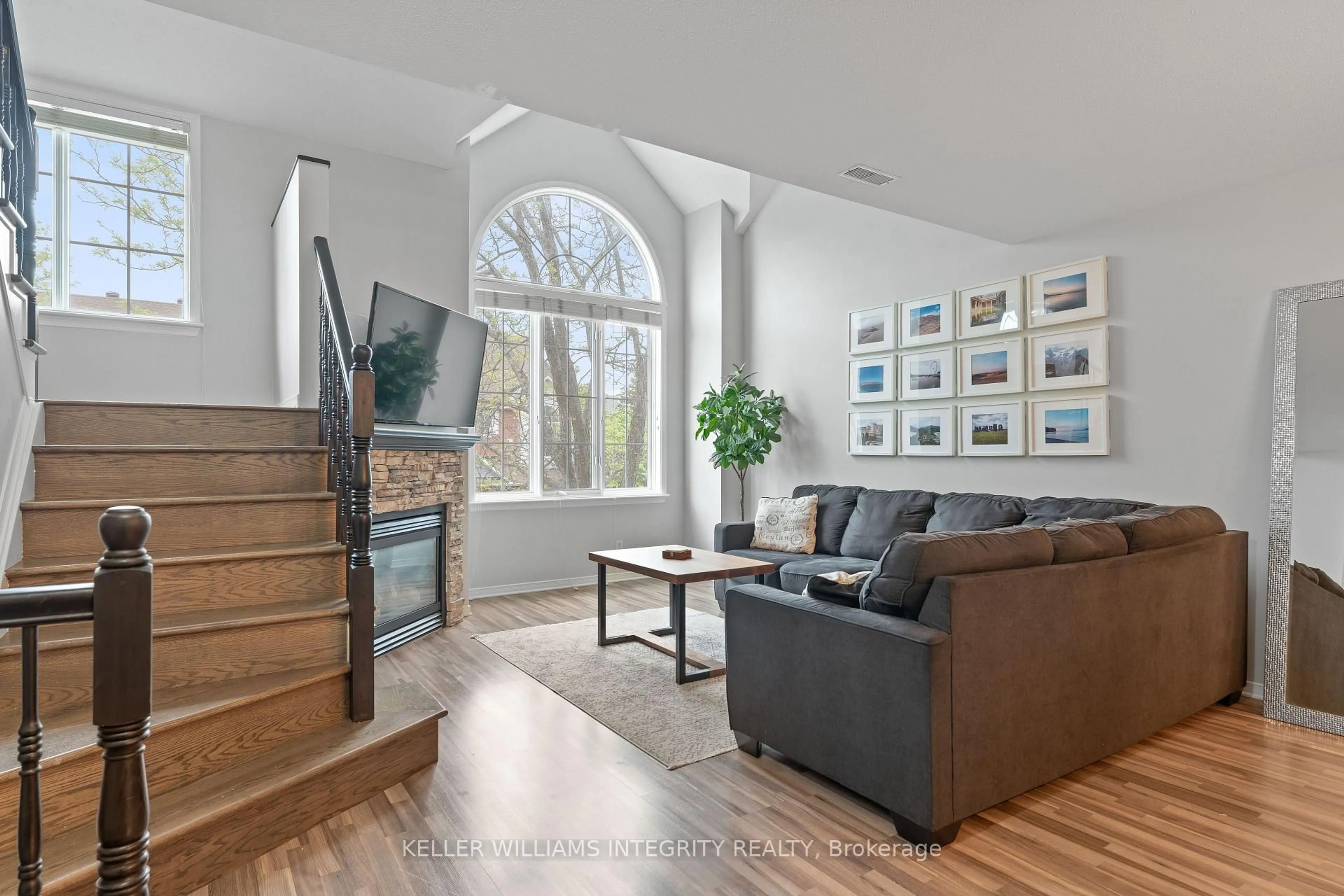 Living room with furniture, wood/laminate floor for 92 Briston Private, Ottawa Ontario K1G 5P6