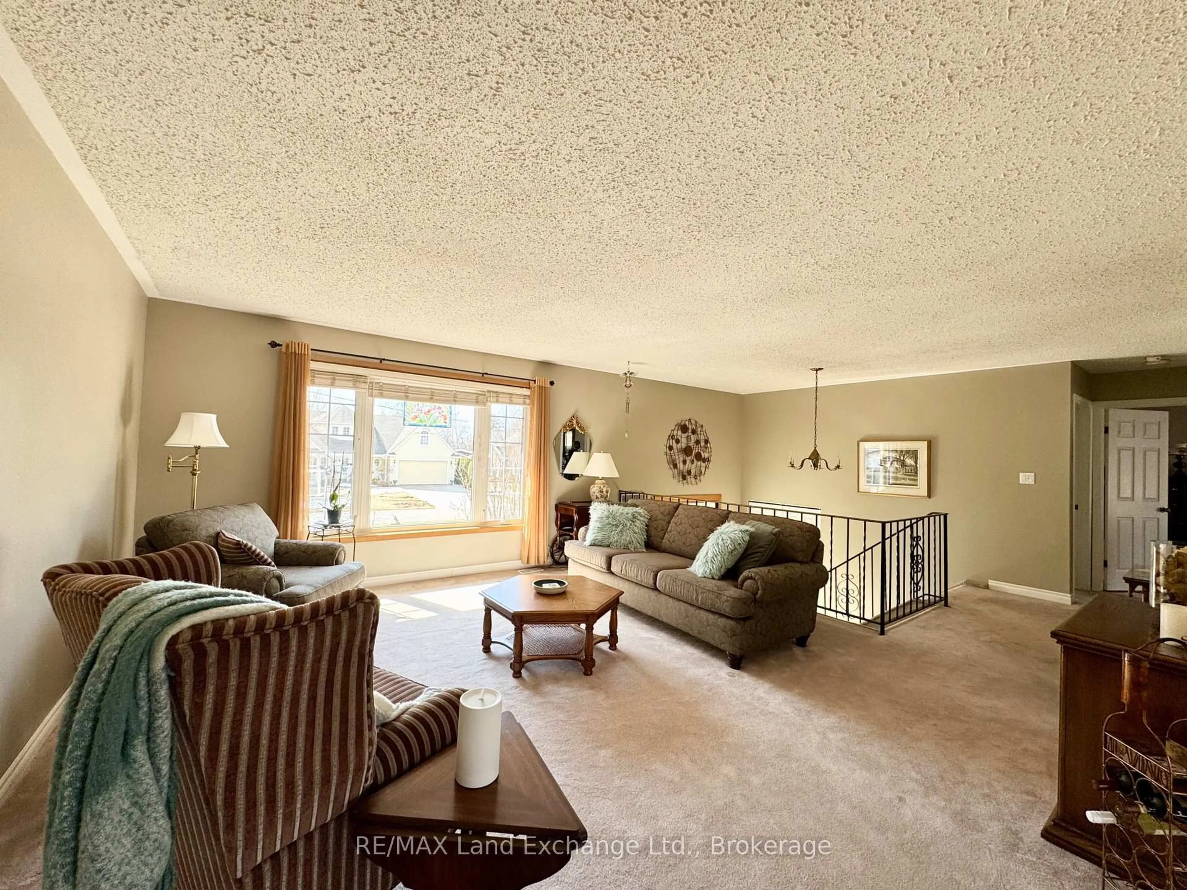 Living room with furniture, carpet floor for 34 Archibald Pl, Saugeen Shores Ontario N0H 2L0